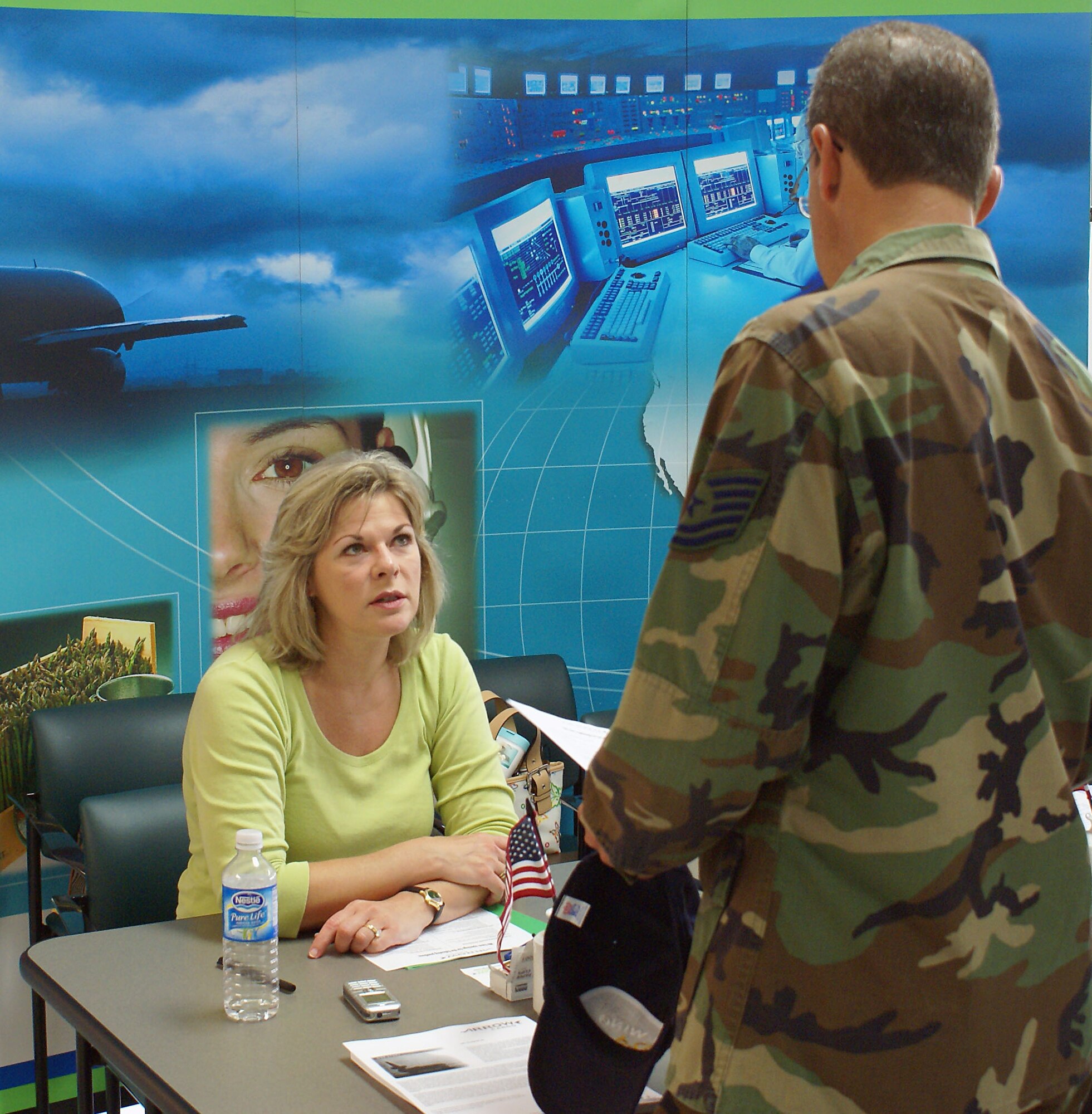 Cindy Trunon of Arrow Cargo speaks to a reservist about job opportunities with her organization at the Human Resource Development Council sponsored aviation job fair here July 14. HRDC plans more fairs in the future focusing on other career fields. (U.S. Air Force photo/Dan Galindo)