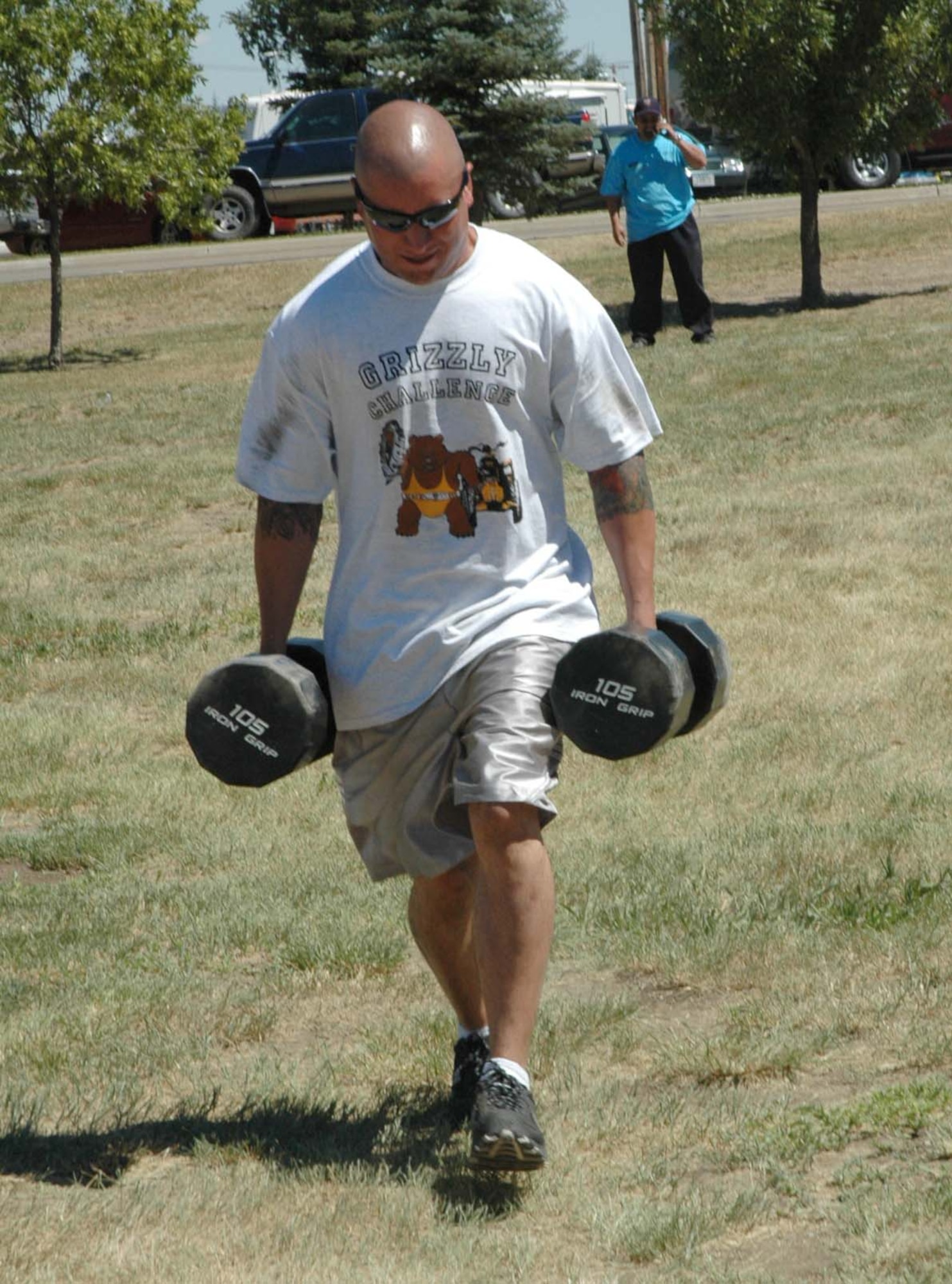 A Grizzly Challenge competitor participates in the Farmer’s Walk portion of the event at last year’s base picnic. (U.S. Air Force photo / Valerie Mullett)