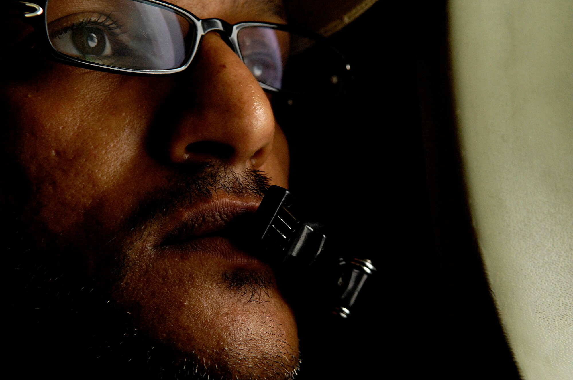 On a low level familiarization flight, Loadmaster Warrant Officer Ahmed Yaslem Abood Balfaqih from the 4th Squadron, United Arab Emirates, scans the terrain in a C-130 Hercules July 17 during a practice mission for Rodeo at McChord Air Force Base, Wash. Rodeo 2007, hosted by Air Mobility Command, is a readiness competition of U.S. and international mobility air forces.  It focuses on improving war fighting capabilities and support of the Global War on Terrorism. (U.S. Air Force photo by Tech. Sgt. Jeremy T. Lock)

