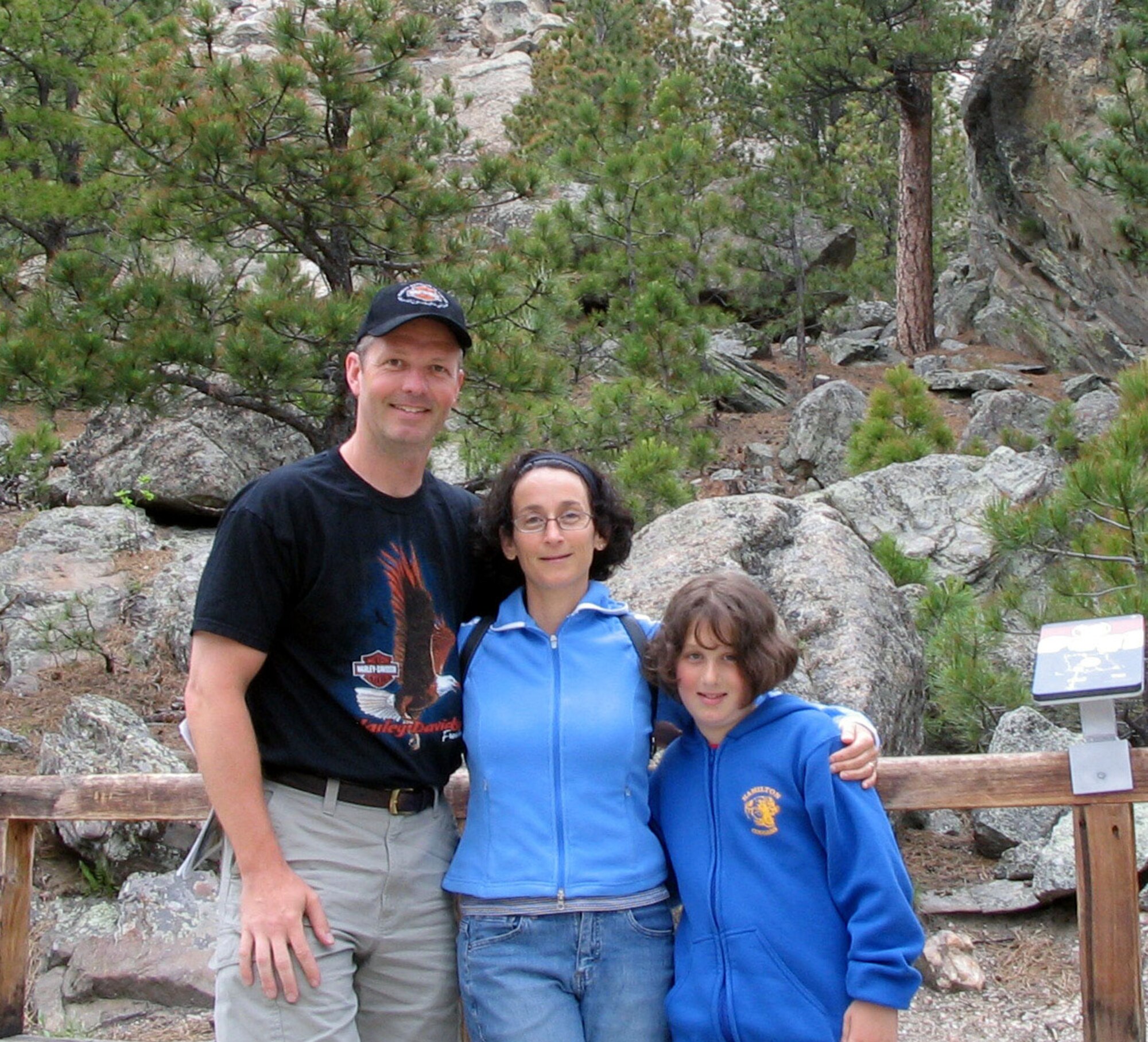 Colonel Watkins, his wife of 19 years, Anne, and their daughter Danielle, 10, pose for a family photo while visiting Mount Rushmore, S.D., in June while enroute to their new home at Malmstrom.  (Courtesy photo)