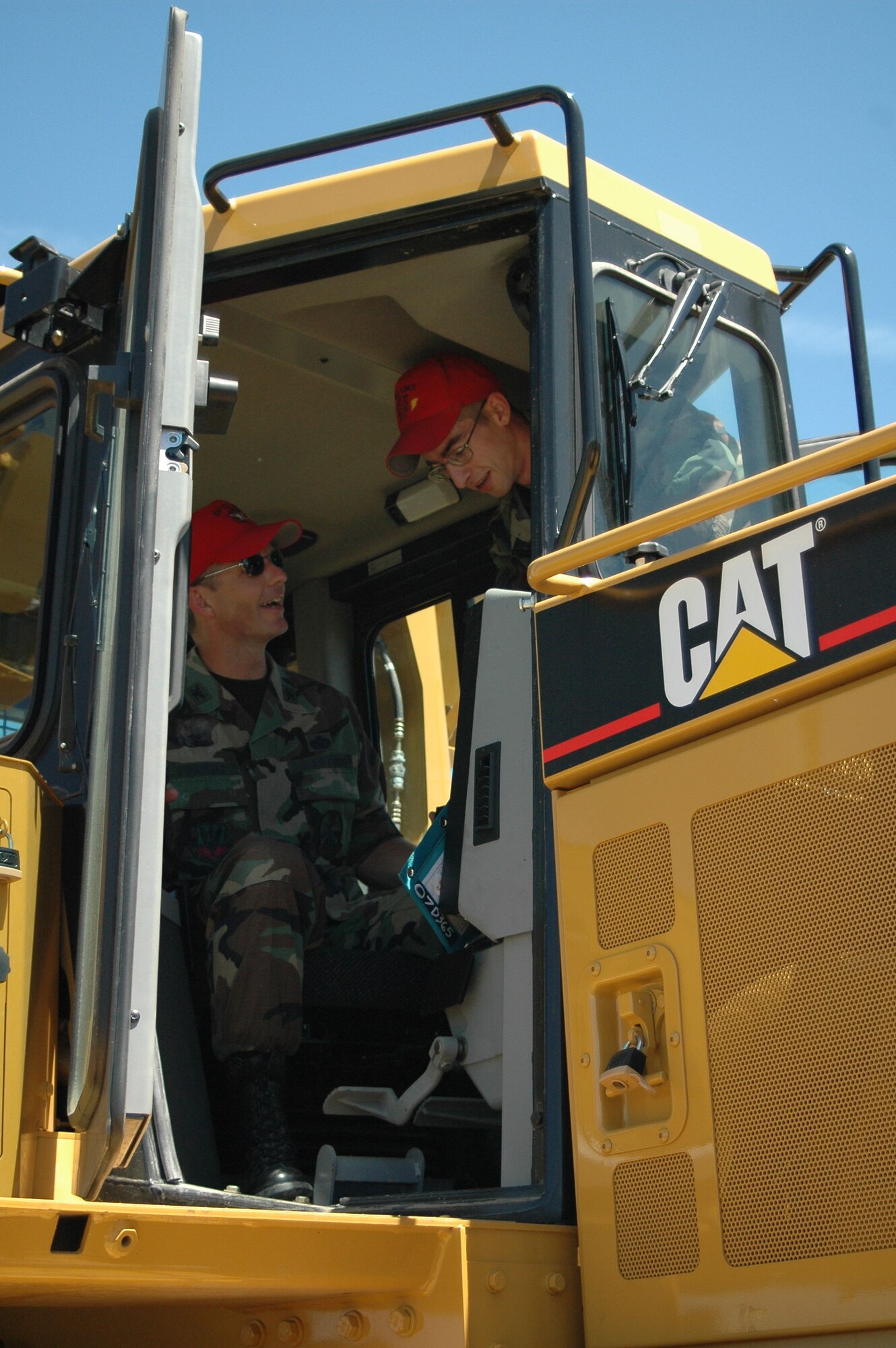 Col. Terry Watkins, 819th RED HORSE Squadron commander, learns how to drive the squadron’s 67,000 pound bulldozer from Senior Airman Ryan Holt, 819th RHS pavements and heavy equipment operator July 5. (U.S. Air Force photo / Senior Airman Eydie Sakura)