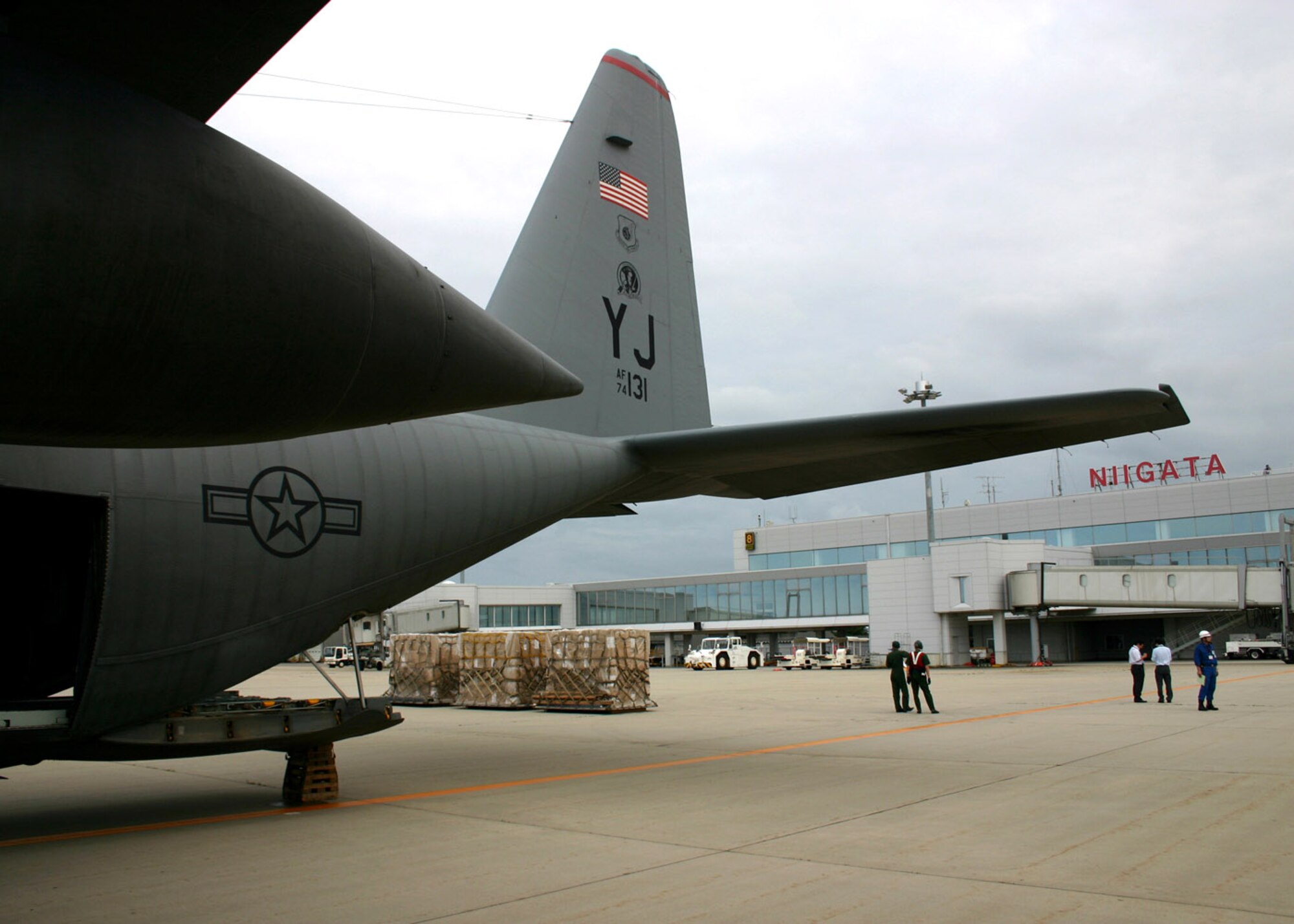 A C-130 Hercules from the 36th Airlift Squadron transported 10,000 pounds of water and 100 air-conditioning units to the Niigata Airport July 18 from Yokota Air Base, Japan. Airmen from the 374th Airlift Wing provided support to Japan after an earthquake hit one of Japan's largest city on the Sea of Japan. (U.S. Marine Corps photo/Maj. Neil Murphy)