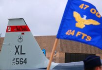 LAUGHLIN AIR FORCE BASE, Texas -- The guidon flag of the new 434th Fighter Training Squadron flies in front of a freshly painted T-38C tail during the activation ceremony of the squadron July 19. The U.S. Air Force has painted the tails of particular aircraft since World War II to help identify their wingman while in flight. (U.S. Air Force photo by Airman Sara Csurilla)