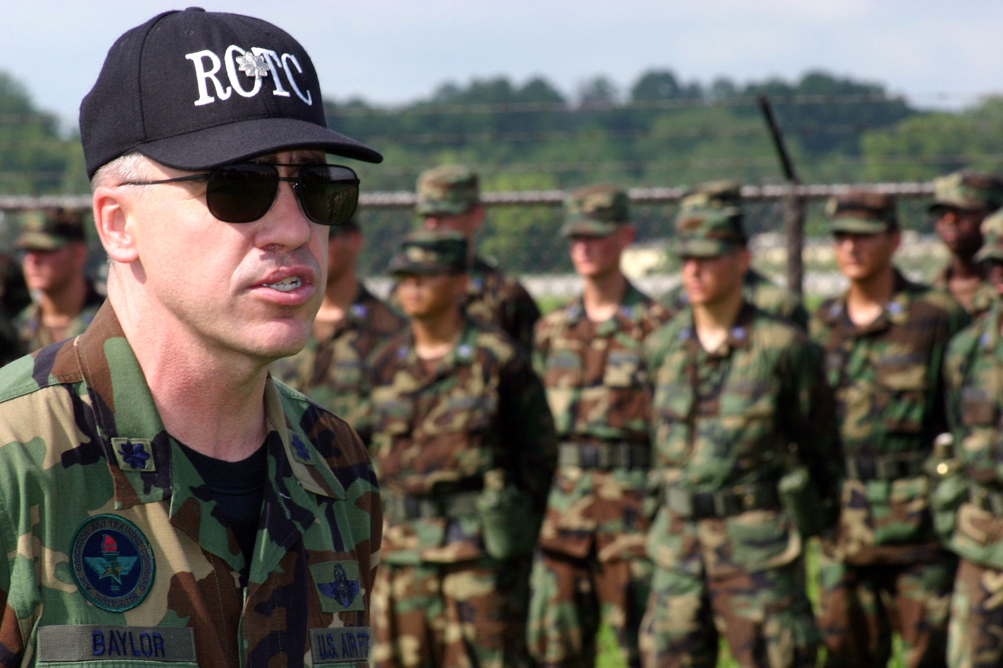 Lt. Col. David Baylor, ROTC cadet field training director of operations, asks cadets to recite all the verses of the Air Force song July 17 during the Prop and Wings Challenge at Maxwell Air Force Base, Ala. The challenge tested more than 330 cadets with mental and physical activities during the 27-day field training event. (U.S. Air Force photo/Staff Sgt. Jason Lake)