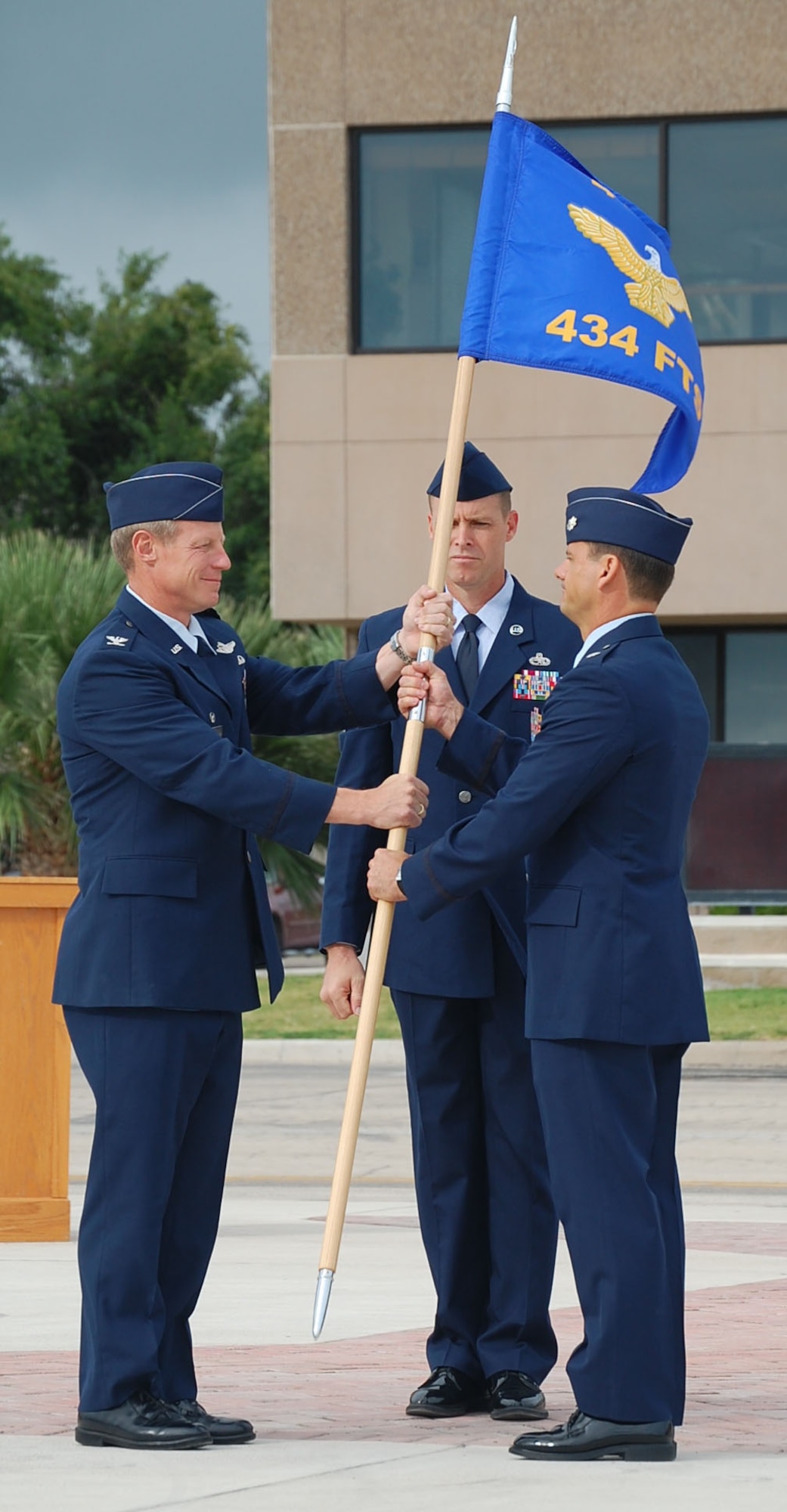 LAUGHLIN AIR FORCE BASE, Texas -- Lt. Col. Gregory Johnson accepts the squadron guidon from Col. David Peterson, 47th Operations Group Commander as he assumes command of the newly activated 434th Fighter Training Squadron July 19. Laughlin's newest squadron will teach recently graduated pilots fighter fundamentals in the T-38C. (U.S. Air Force photo by Airman Sara Csurilla)

