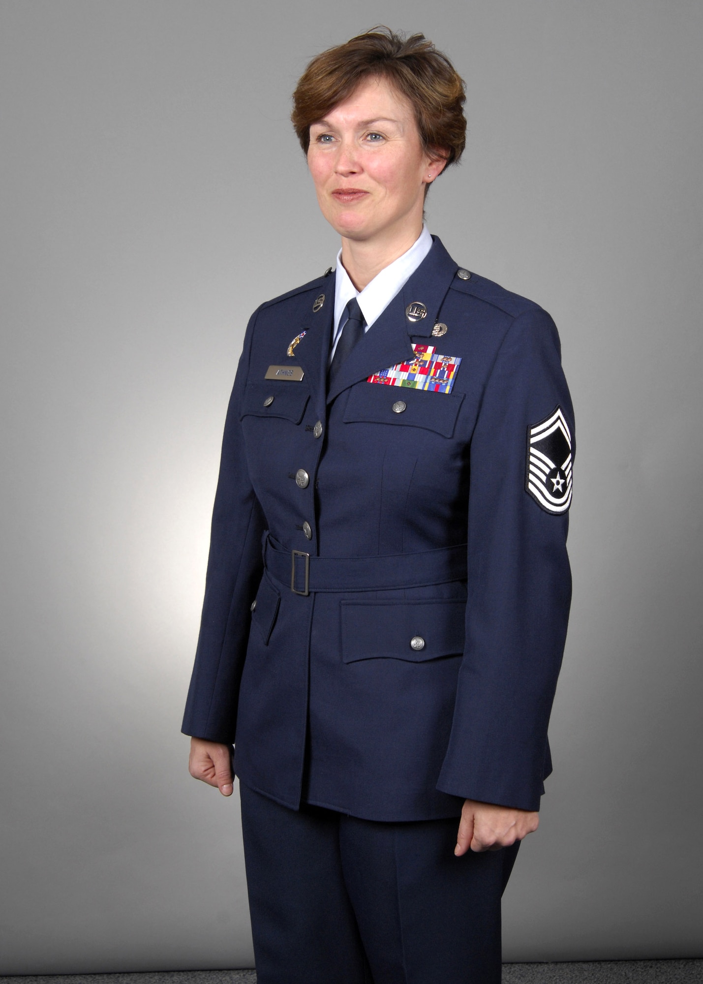 Senior Master Sgt. Dana Athnos models the new Air Force service dress Heritage Coat, designed on the uniform worn by Gen. Hap Arnold. The Air Force launches a fit test this fall with an actual 90-day wear test in the spring of 2008. According to Air Force leaders, the Heritage Coat will give the service a more military look that reflects the warrior ethos Airmen have today. (U.S. Air Force photo/Tech. Sgt. Cohen Young)