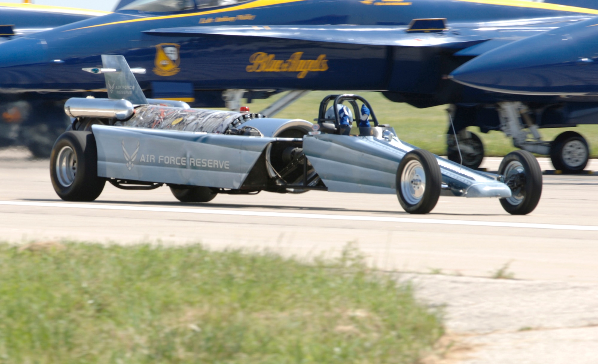 MCCONNELL AIR FORCE BASE, Kan. -- Scott Hammack races the Air Force Reserve jet car down the flightline July 14 at McConnell’s Open House, which took place here July 14-15. The car eventually reached a speed of 381 miles per hour as it sped across the flightline during the event. Mr. Hammack is a veteran who served in Vietnam, and for the 26 years, he has raced his personally-developed jet car at public events for the Air Force Reserve. (Photo by Airman Justin Shelton) 