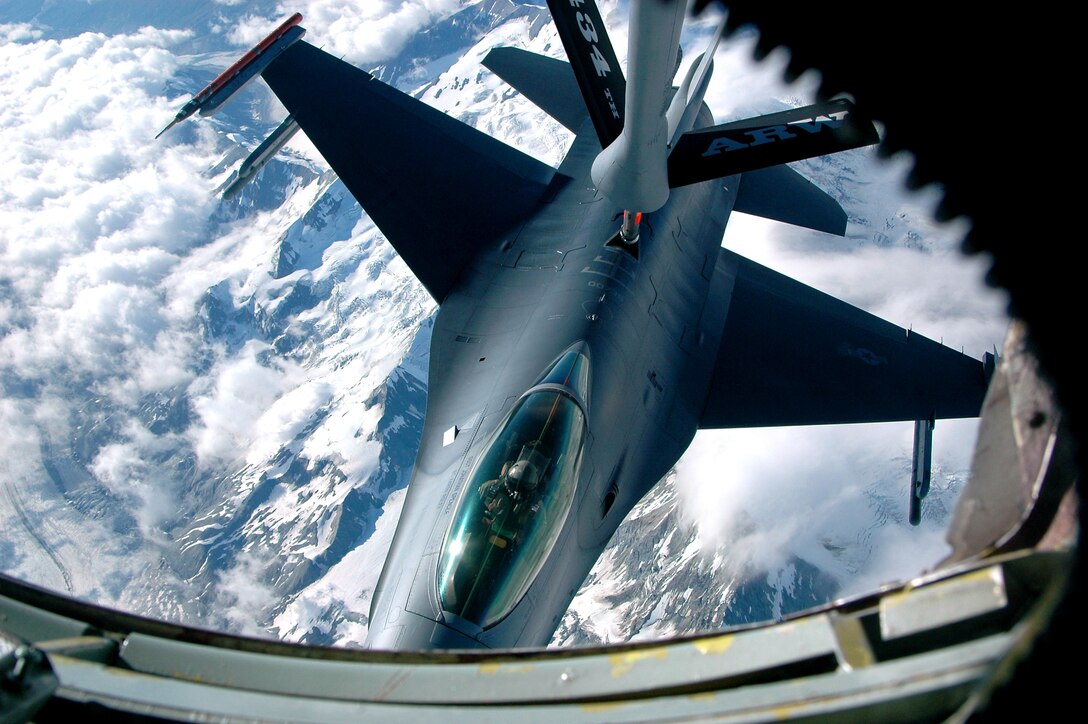 A KC-135 Stratotanker from Grissom Air Reserve Base, Ind., provides in-flight refueling to an F-16 Fighting Falcon from Eielson Air Force Base, Alaska, over the Pacific Alaska Range Complex during Red Flag-Alaska July 16. Red Flag-Alaska is a multinational air combat training exercise that began July 12 and will conclude July 28. (U.S. Air Force photo/Staff Sgt. Shawn J. Jones) 