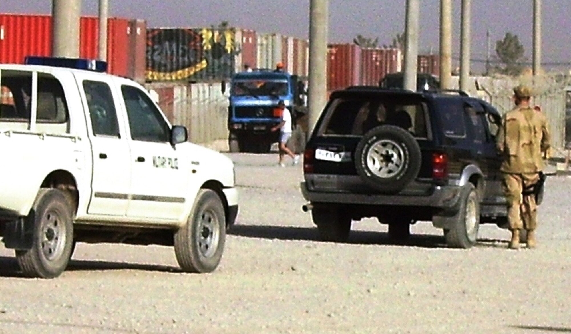 A Peterson Airman issues a traffic citation to a driver at Kandahar Air Field, Afghanistan. Twenty-two 21st Security Forces Squadron Airmen are deployed supporting Operation Enduring Freedom (U.S. Air Force photo)