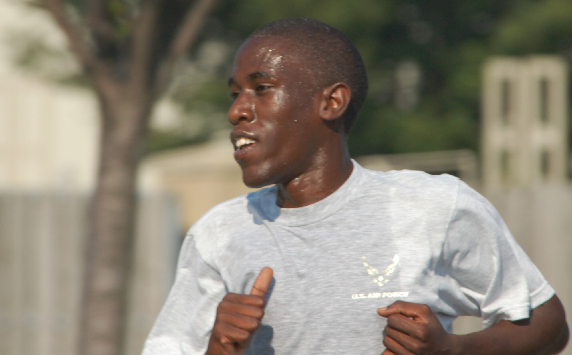 Airman 1st Class James Ambenge, 436th Logistics Readiness Squadron vehicle management analysis controller, leads Team Dover in the July Warrior Run. Airman Ambenge completed the 3.1 mile run in 16 minutes, 57 seconds. (U.S. Air Force photo/Tech. Sgt. Kevin Wallace)