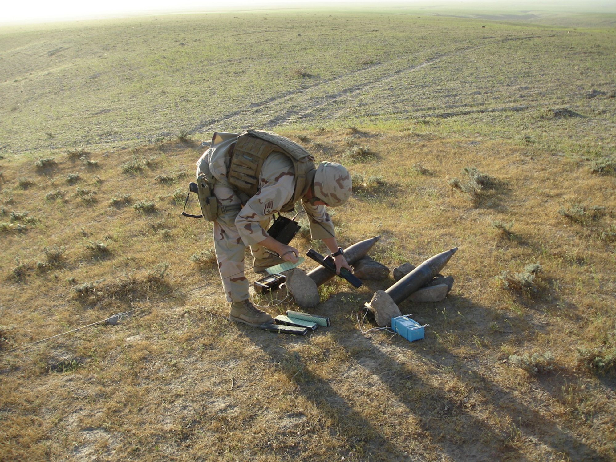 Staff Sgt. Kenneth Roads, formerly of Peterson’s Explosive Ordinance Detachment, destroys rockets on a timer pointed at Bagram. Most members of the Peterson unit have deployed to Iraq and Afghanistan, where they’ve helped dismantle IEDs and landmines. (U.S. Air Force photo)