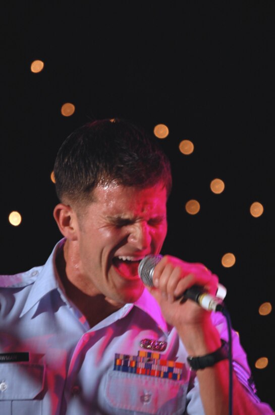 SSgt Craig Bowman demonstrating severe emotion during a rock band performance at the 2007 Royal International Air Tattoo salute party.  The rock band performed for several thousand enthusiastic aviators, crew and Air Tattoo affiliates.