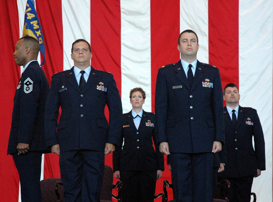 MCGUIRE AIR FORCE BASE, N.J. -- Air Force Reserve maintenance officer, Lt. Col. Nicholas Koski-Vacirca, left, relinquishes command of the 514th Maintenance squadron to Maj. Jeffrey P. Matthew, right. The new commander was one-of-three officers to receive command, Sunday during a historic first-ever triple change-of-command ceremony held here in the 514th Air Mobility Wing. U.S Air Force photo/Master Sgt. Donna T. Jeffries
