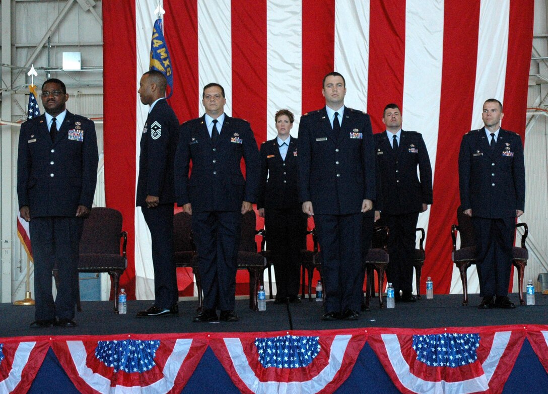 MCGUIRE AIR FORCE BASE, N.J. -- Maj. Jeff Matthew, front row right, is the first of three Reserve officers to accept command of a maintenance squadron Sunday, during the 514th Air Mobility Wing's historic triple change-of-command ceremony held here.  U.S Air Force photo/Master Sgt. Donna T. Jeffries