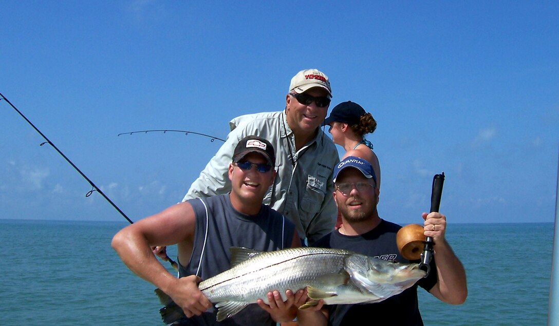 John Bunch, a former Marine and current southwestern Florida fishing guide, shows off a snook he and Operation Open Arms participants caught during a day of fishing. Bunch started Operation Open Arms in 2005 to provide servicemembers home on leave with free or discounted services and activities before they return to their foreign duty stations. Courtesy photo