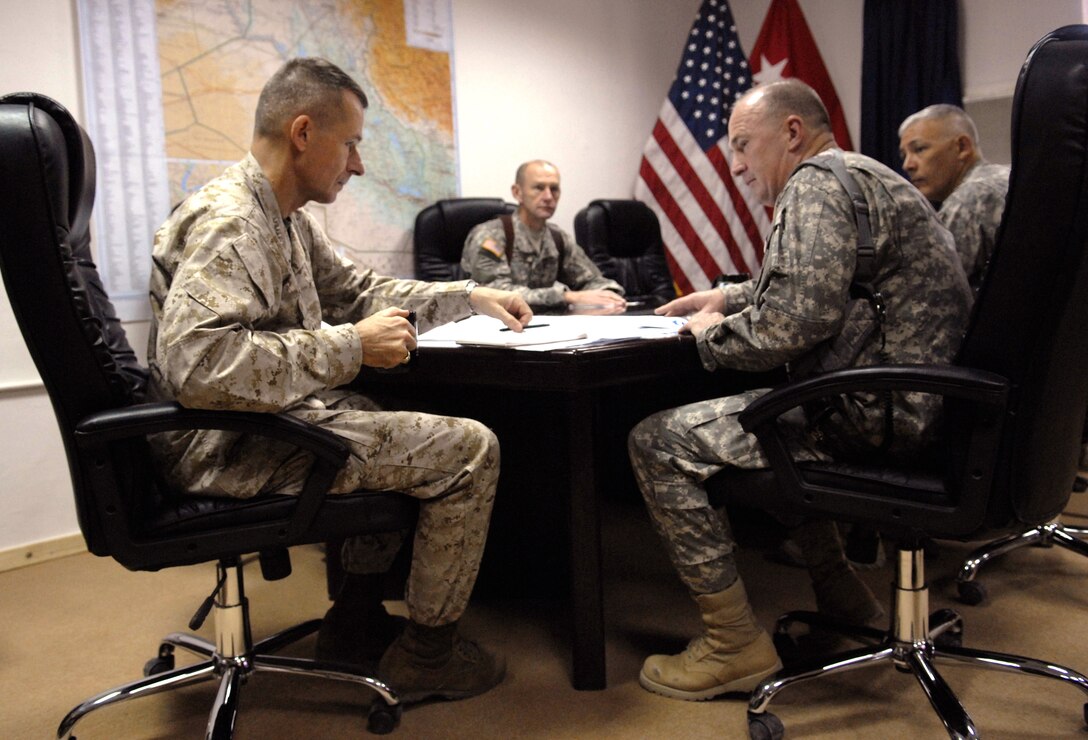 Chairman of the Joint Chiefs of Staff U.S. Marine Gen. Peter Pace holds an office call with Maj. Gen. Rick Lynch and other senior officials at Camp Liberty, Iraq, July 17, 2007.