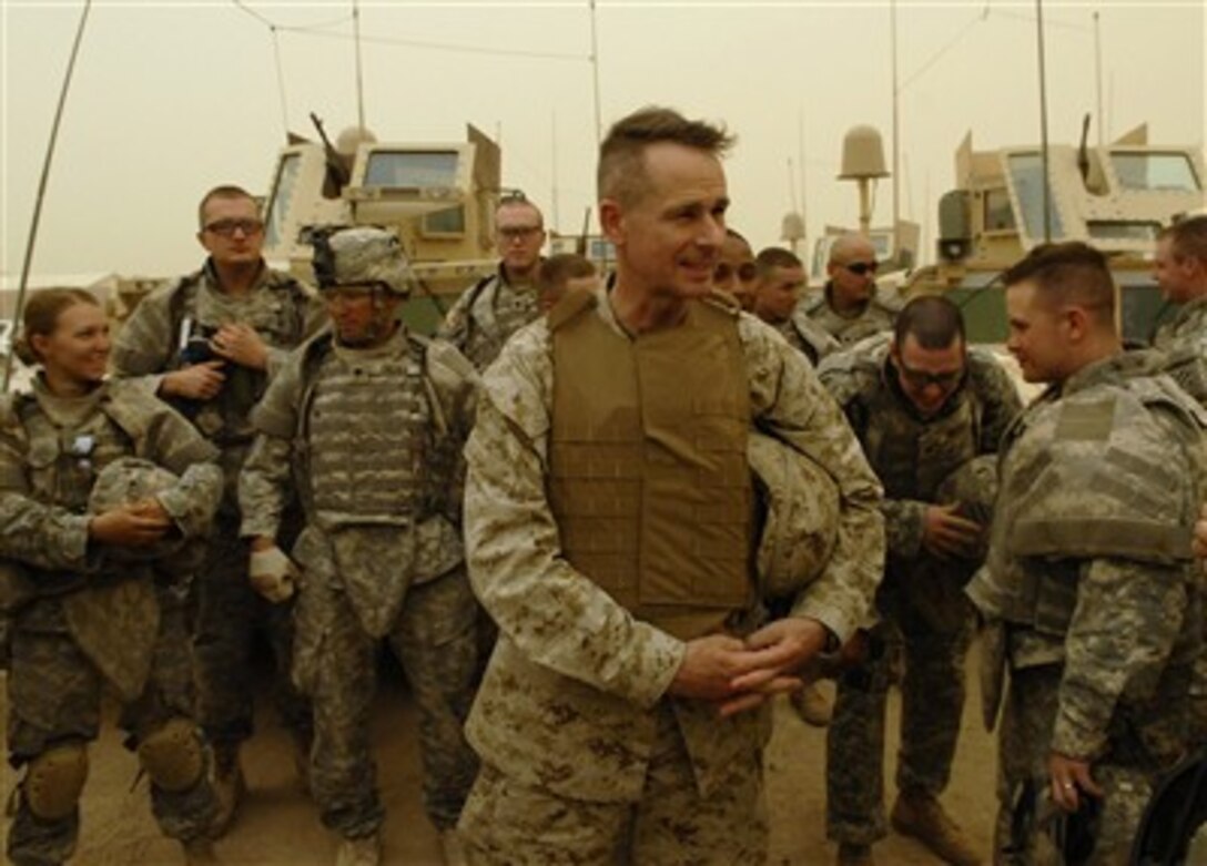 Chairman of the Joint Chiefs of Staff Gen. Peter Pace, U.S. Marine Corps, interacts with U.S. Army soldiers at the Brigade Headquarters in Ramadi, Iraq, on July 17, 2007.  Pace chose to visit the streets of Ramadi after a dust storm grounded his scheduled departure flight. 