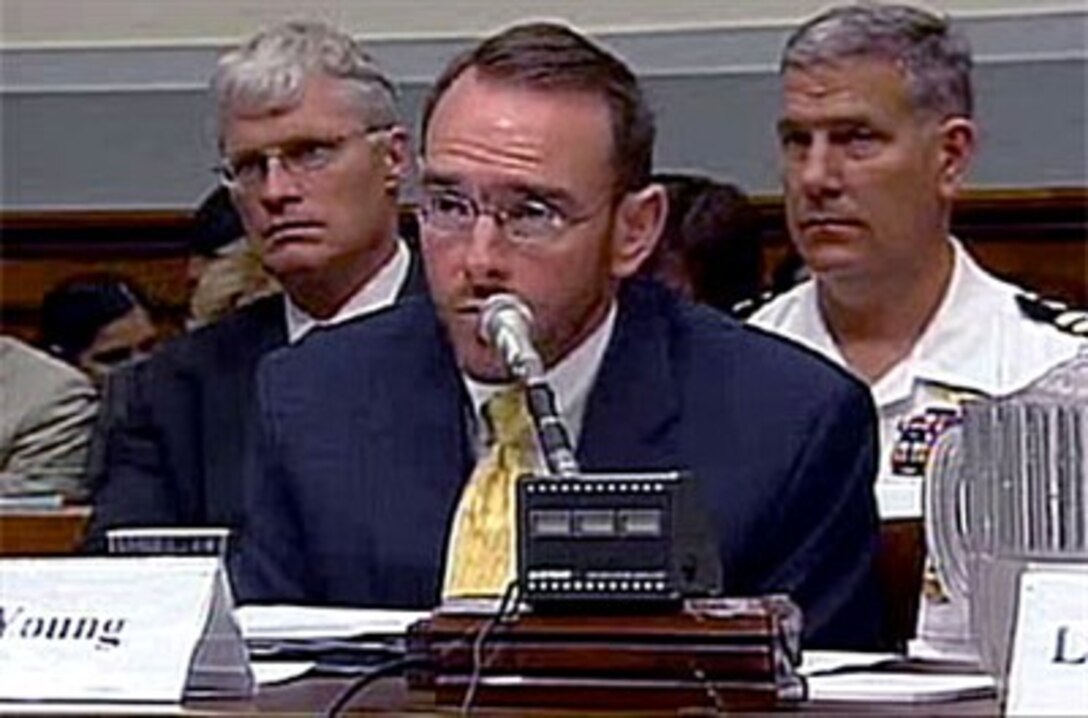 John Young, director of Defense Research and Engineering, Mine Resistant Ambush Protected Task Force, gives opening remarks during testimony before the House Armed Services Joint Seapower and Expeditionary Forces and Air and Land Forces Subcommittees in Washington, July 19, 2007.
