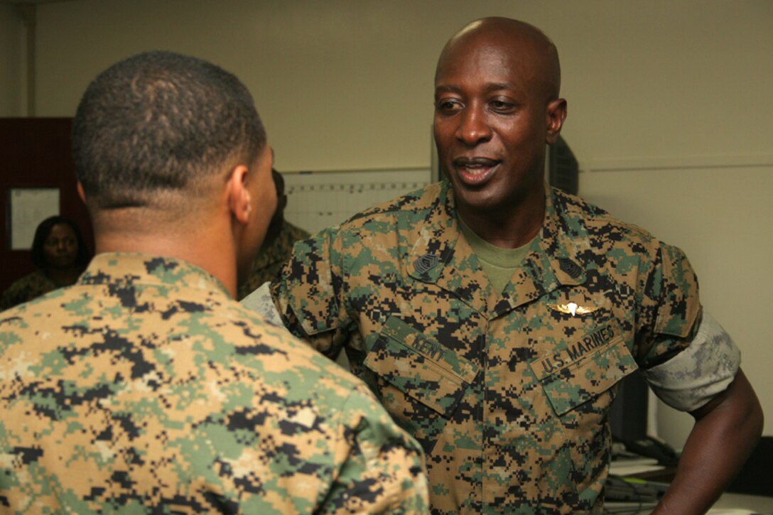 Sergeant Major of the Marine Corps Sgt. Maj. Carlton W. Kent speaks with Lance Cpl. Walter C. Jimison, Combat Logistics Company 36 combat service support specialist and native of Palmdale, Calif., at CLC-36 headquarters during the sergeant major?s visit July 19.