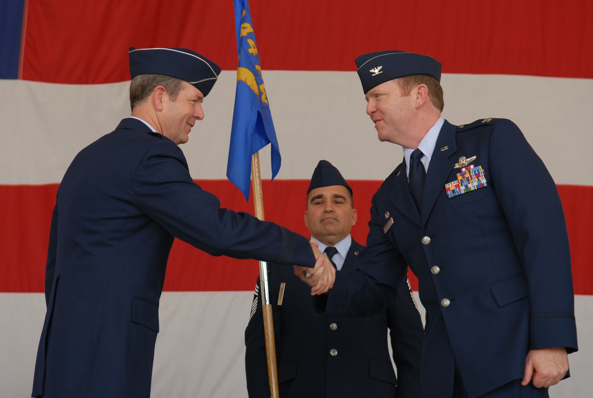 Brig. Gen. Thomas Coon, 10th Air Force commander, shakes the hand of Col. Richard Scobee as he takes command of the 944th Fighter Wing. Colonel Scobee has more than 3,800 flying hours, including 248 combat hours.  Photo by Airman 1st Class Gustavo Gonzalez.