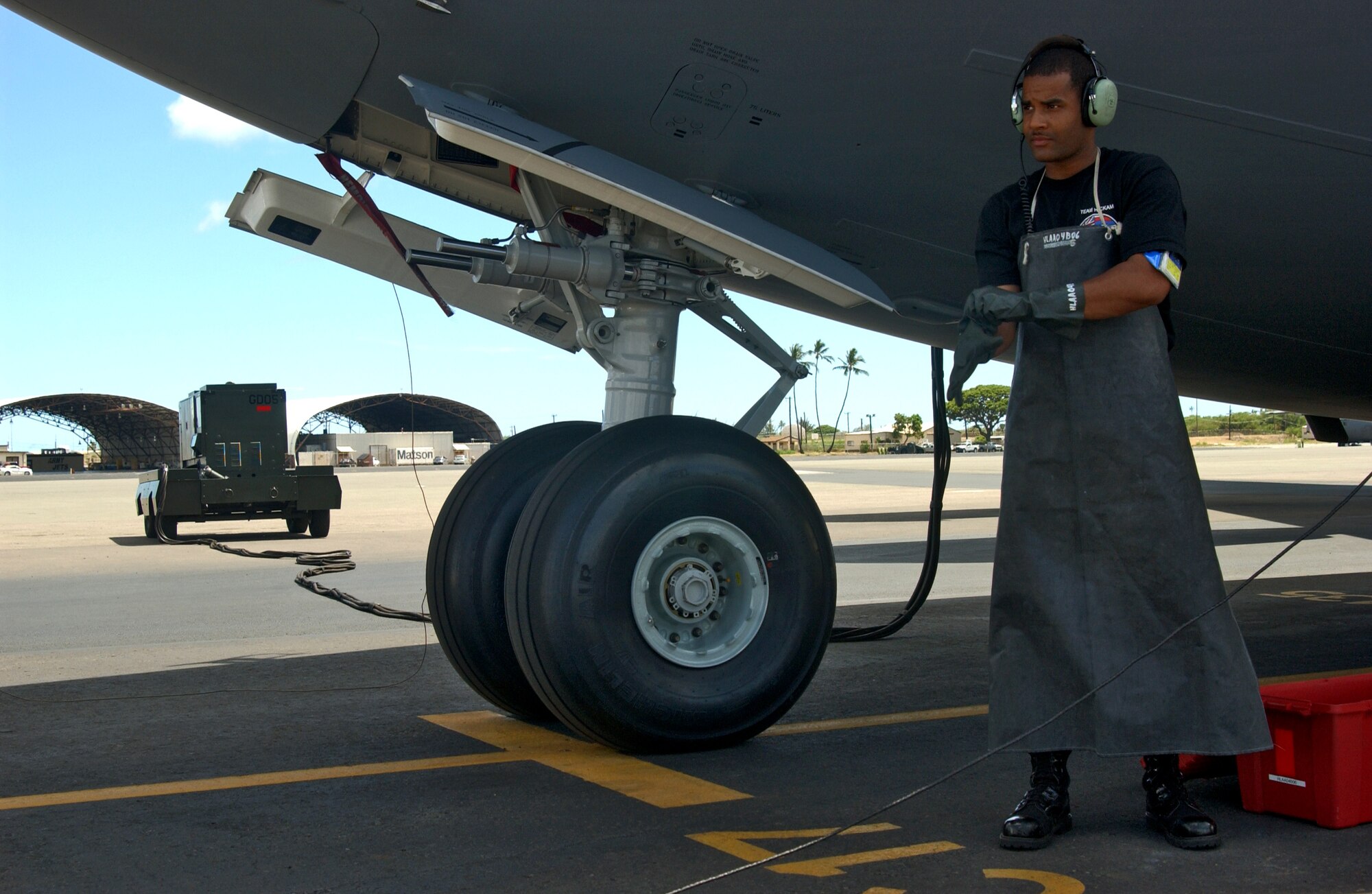 Senior Airman Krystopher Douglas, 15th Aircraft Maintenance Squadron, prepares to drain the single point refuel mainfold during a ground refueling mission in preparation for the Air Mobility Command Aircraft Rodeo at McChord AFB, Wash. Photo by Senior Airman Erin Smith
