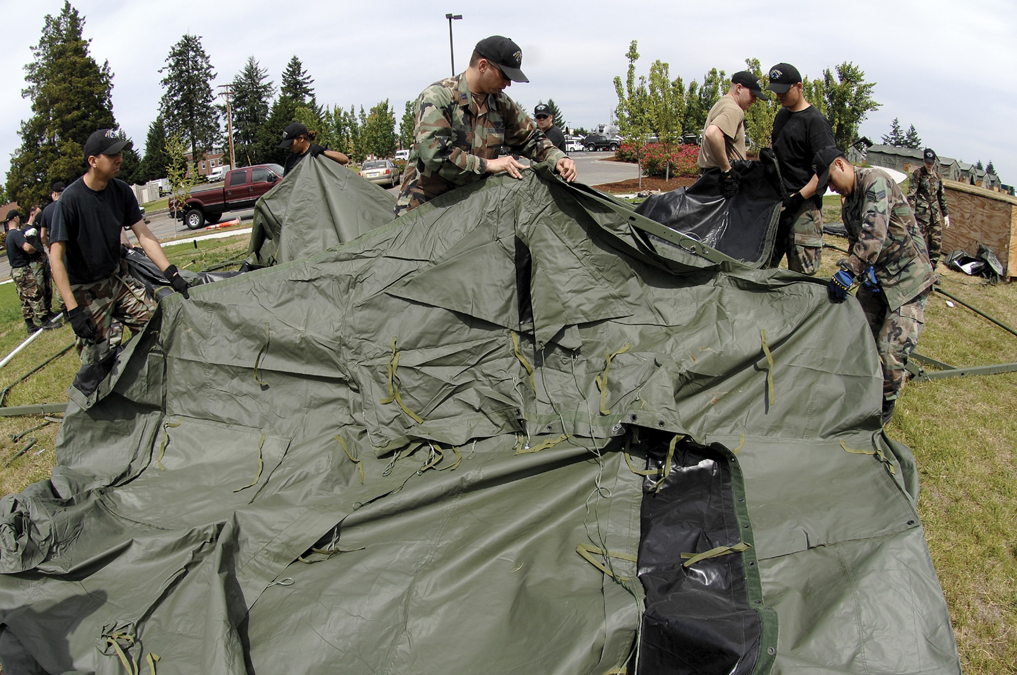 Rodeo wranglers set up tents for Rodeo competitors at Rainier Ranch.  The ranch will not only be a second home to some of Rodeo's competitors, it will also be the site for daily post-event relaxation and entertainment.  (U.S. Air Force photo/Abner Guzman)