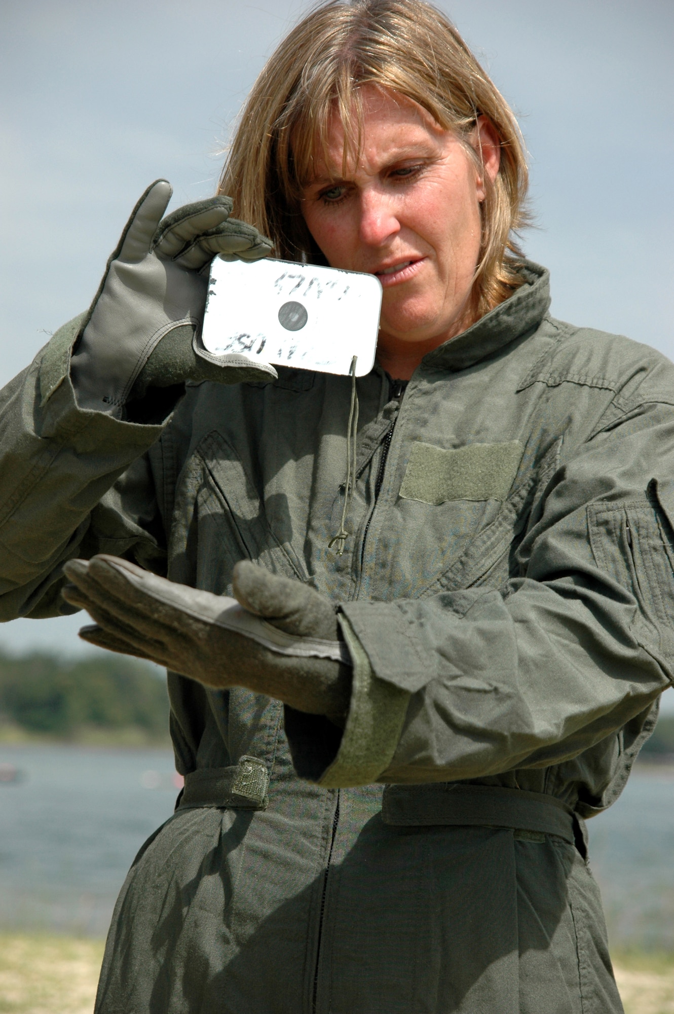 EGLIN AIR FORCE BASE, Fla. -- Marion Riley Taylor practices using a signal mirror during Survival Skills Day on Eglin Air Force Base July 20. Ms. Riley Taylor is an honorary commander for the 33d Fighter Wing's 33d Maintenance Squadron and participated in the event, during which honorary commanders learned land and water survival tactics wing pilots are trained to use in emergency situations. Honorary commanders are civic leaders paired with wing leadership for a year-long immersion in the mission, with a goal of educating the civilians about the Air Force and its people. Honorary commanders from the 53d Wing also participated. (U.S. Air Force photo by Staff Sgt. Bryan Franks)
