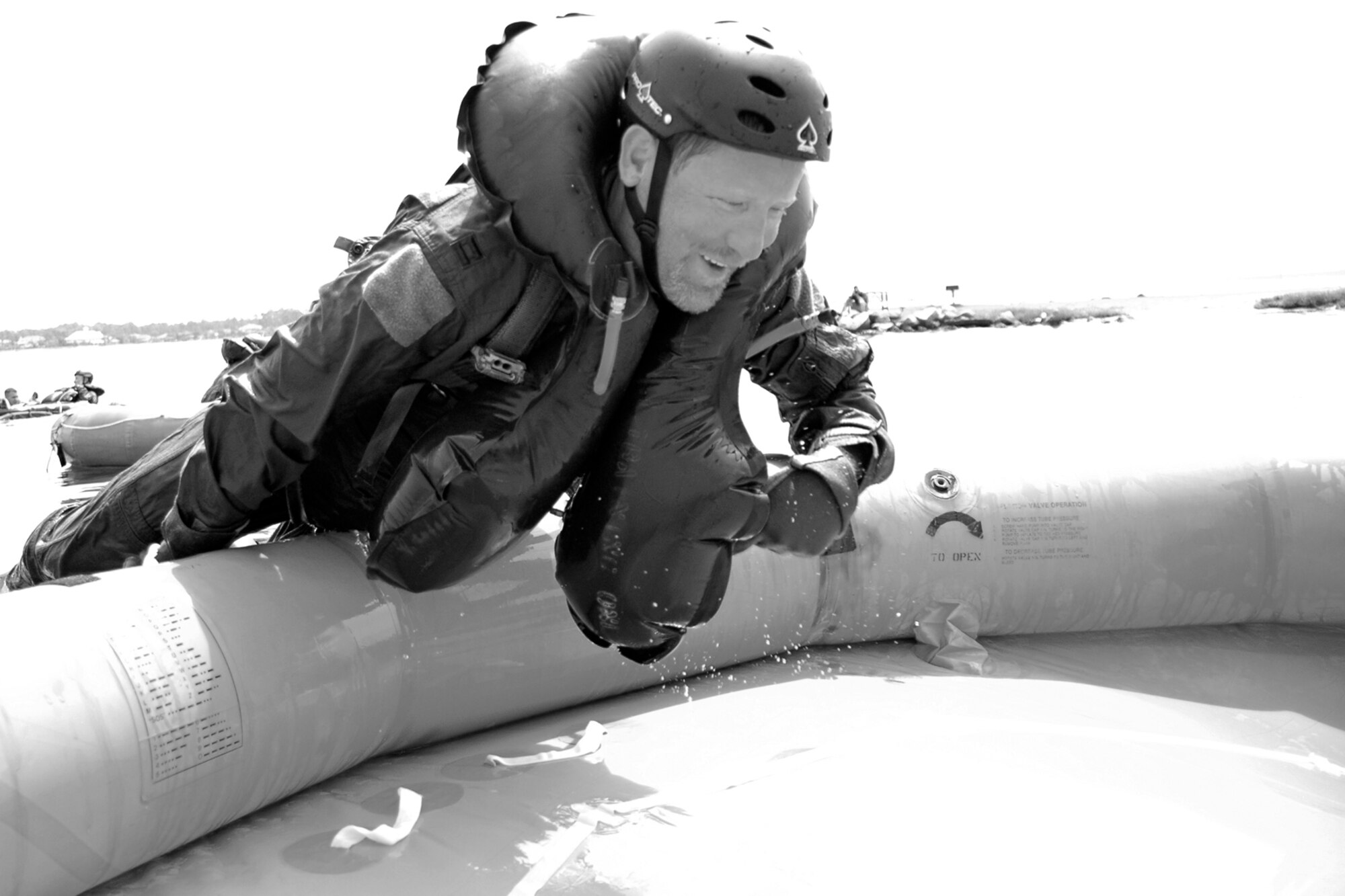 EGLIN AIR FORCE BASE, Fla. -- Steve Horton, honorary commander for the 33d Fighter Wing's 33d Maintenance Operations Squadron, dives into a life raft July 20 during Survivor Skills Day. The event taught honorary commanders land and water survival tactics wing pilots are trained to use in emergency situations. Honorary commanders are civic leaders paired with wing leadership for a year-long immersion in the mission, with a goal of educating the civilians about the Air Force and its people. Honorary commanders from the 53d Wing also participated. (U.S. Air Force photo by Staff Sgt. Bryan Franks)
