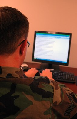 Staff Sgt. Nick Przybyciel, 446th Airlift Wing, McChord Air Force Base, Wash., and a member of the Air Mobility Rodeo 2007 public affairs staff, works on a story about the readiness competition at his office at McChord July 20.  Air Mobility Command's Rodeo is a readiness competition of U.S. and international mobility air forces.  It focuses on improving warfighting capabilities and support of the Global War on Terrorism.  (U.S. Air Force Photo/Tech. Sgt. Scott T. Sturkol)