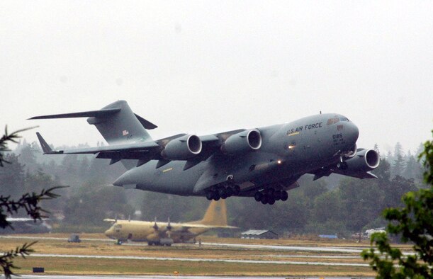 A C-17 Globemaster III from McChord Air Force Base, Wash., takes off for a practice mission at McChord July 20.  The C-17 will be one of the airlift planes McChord is using for Air Mobility Rodeo 2007.  Air Mobility Command's Rodeo is a readiness competition of U.S. and international mobility air forces.  It focuses on improving warfighting capabilities and support of the Global War on Terrorism.  (U.S. Air Force Photo/Tech. Sgt. Scott T. Sturkol)