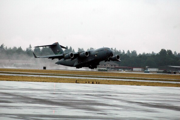 A C-17 Globemaster III from McChord Air Force Base, Wash., takes off for a practice mission at McChord July 20.  The C-17 will be one of the airlift planes McChord is using for Air Mobility Rodeo 2007.  Air Mobility Command's Rodeo is a readiness competition of U.S. and international mobility air forces.  It focuses on improving warfighting capabilities and support of the Global War on Terrorism.  (U.S. Air Force Photo/Tech. Sgt. Scott T. Sturkol)