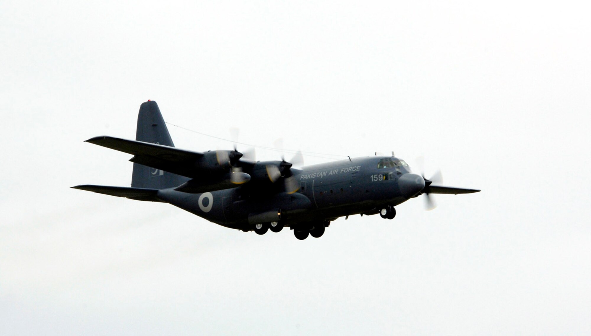 A Pakistani C-130 flies over McChord Air Force Base, Wash., July 19 prior to the start of international competition for Rodeo 2007. Air Mobility Command's Rodeo 2007 is a readiness competition of U.S. and international mobility air forces. It focuses on improving warfighting capabilities and support of the war on terrorism. (U.S. Air Force photo/Tech. Sgt. Maria J. Bare)