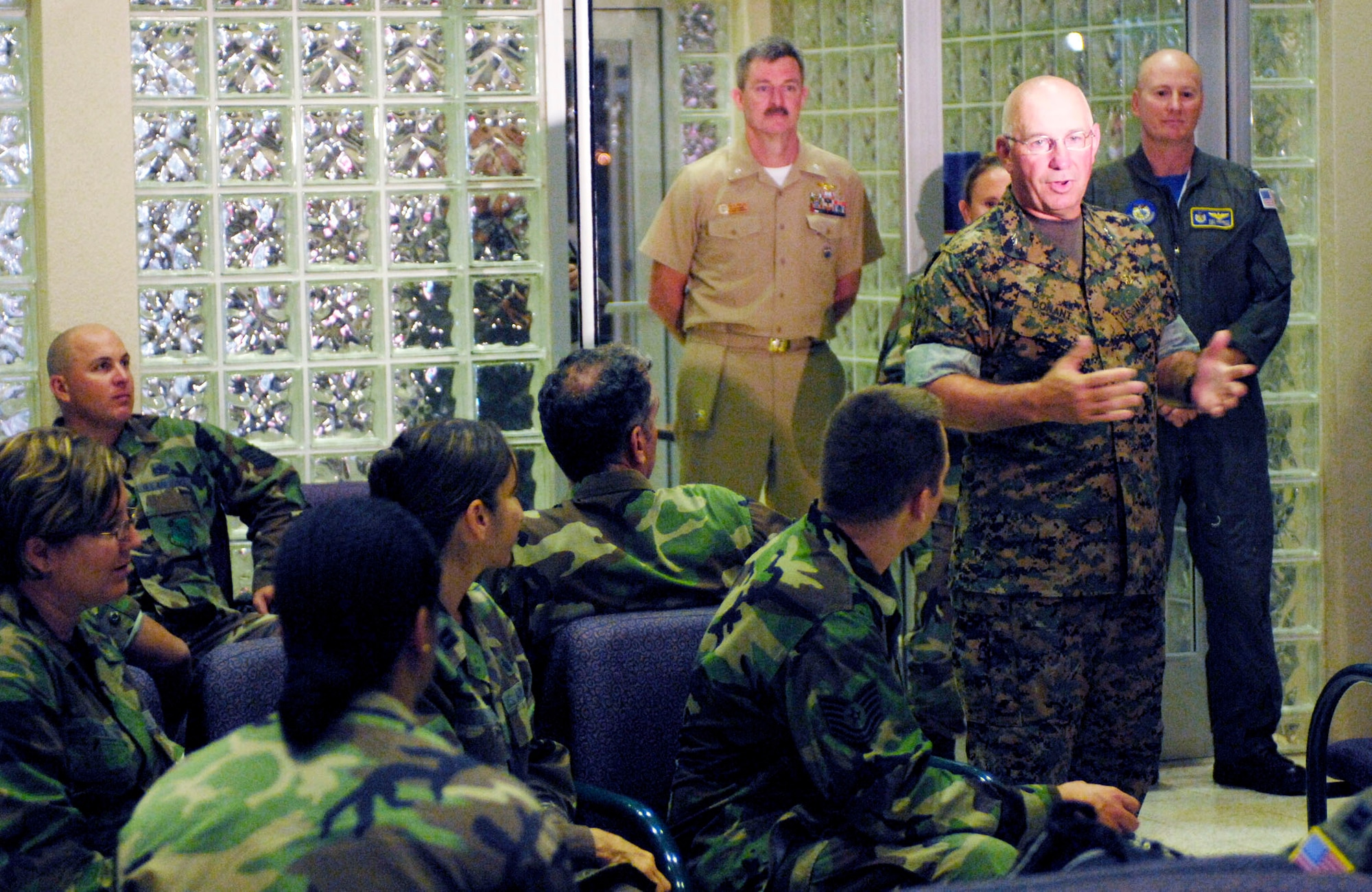 Marine Maj. Gen. Thomas Conant speaks to medics prior to them leaving for a humanitarian mission July 20 at the passenger terminal on Hickam Air Force Base, Hawaii. Approximately 50 Airmen, Soldiers and Sailors will travel to Vanuatu, Kiribati and Nauru to provide medical, dental and engineering support to the residents of the Pacific islands. General Conant is the U.S. Pacific Command director for strategic planning and policy. (U.S. Air Force photo/Tech. Sgt. Shane A. Cuomo) 