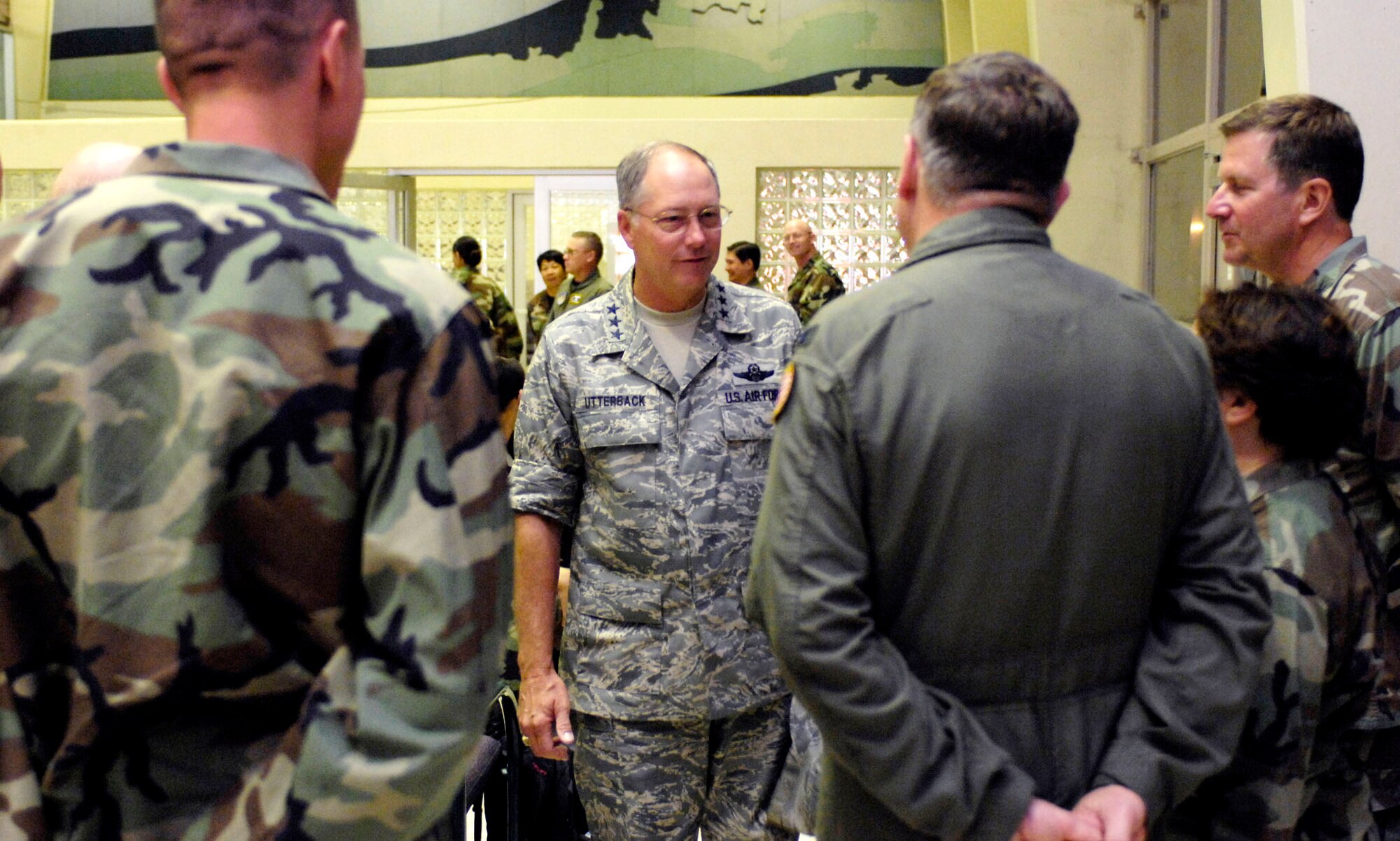 Lt. Gen. Loyd S. Utterback speaks to medics prior to them leaving for a humanitarian mission July 20 at the passenger terminal on Hickam Air Force Base, Hawaii. Approximately 50 Airmen, Soldiers and Sailors will travel to Vanuatu, Kiribati and Nauru to provide medical, dental and engineering support to the residents of the Pacific islands. General Utterback is the 13th Air Force commander. (U.S. Air Force photo/Tech. Sgt. Shane A. Cuomo) 
