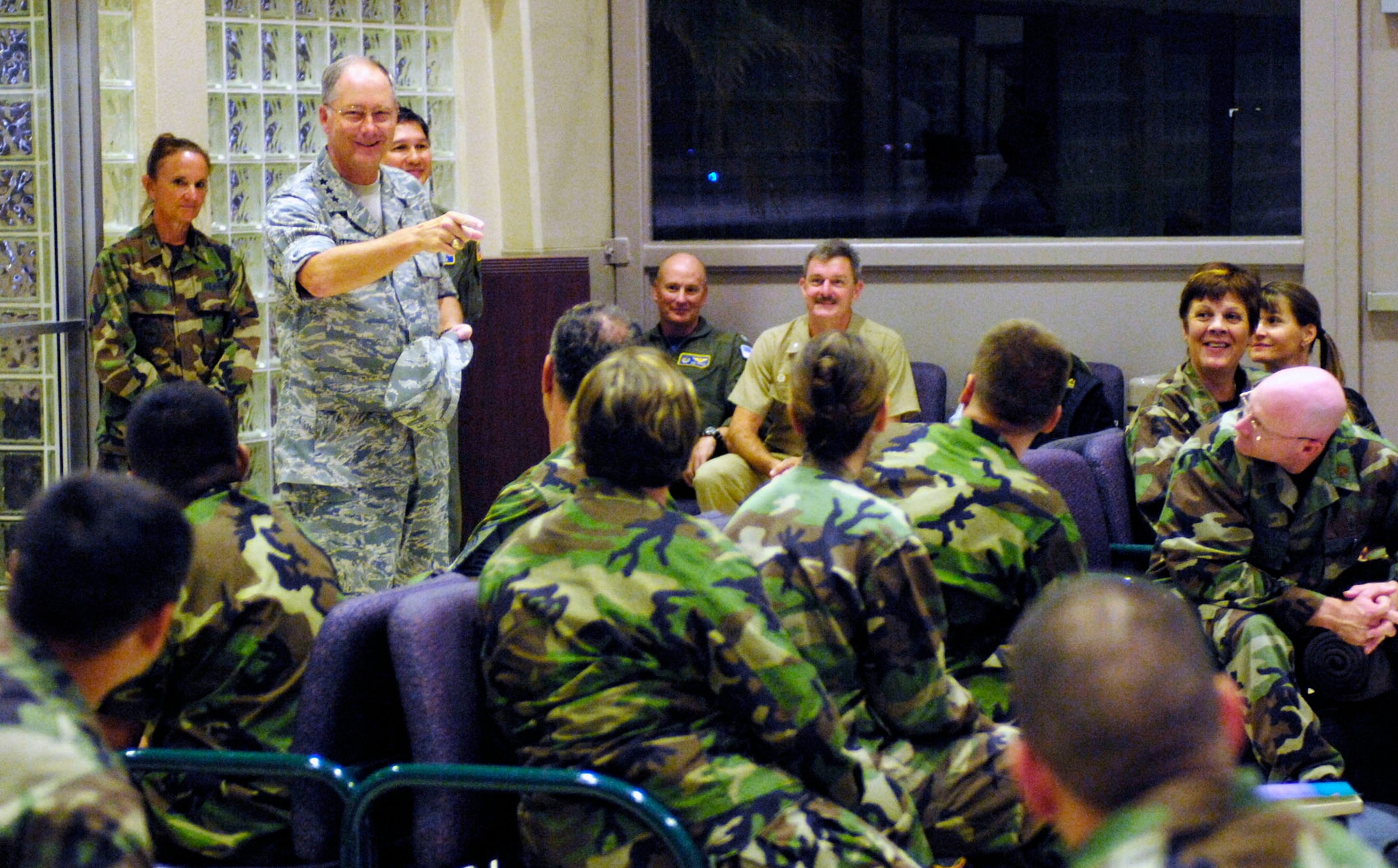 Lt. Gen. Loyd S. Utterback speaks to medics prior to them leaving for a humanitarian mission July 20 at the passenger terminal on Hickam Air Force Base, Hawaii. Approximately 50 Airmen, Soldiers and Sailors will travel to Vanuatu, Kiribati and Nauru to provide medical, dental and engineering support to the residents of the Pacific islands. General Utterback is the 13th Air Force commander. (U.S. Air Force photo/Tech. Sgt. Shane A. Cuomo)