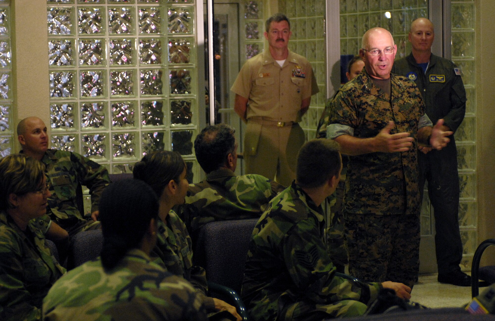 HICKAM AIR FORCE BASE, Hawaii -- Marine Corps Maj. Gen. Thomas Conant, U.S. Pacific Command Director for Strategic Planning and Policy, speaks to medical personnel at the passenger terminal here prior to their departure for a humanitarian mission July 20. Approximately 50 Air Force, Army and Navy personnel will travel to Vanuatu, Kiribati and Nauru to provide medical, dental and engineering support to the local residents. (U.S. Air Force photo/Tech. Sgt. Shane A. Cuomo)