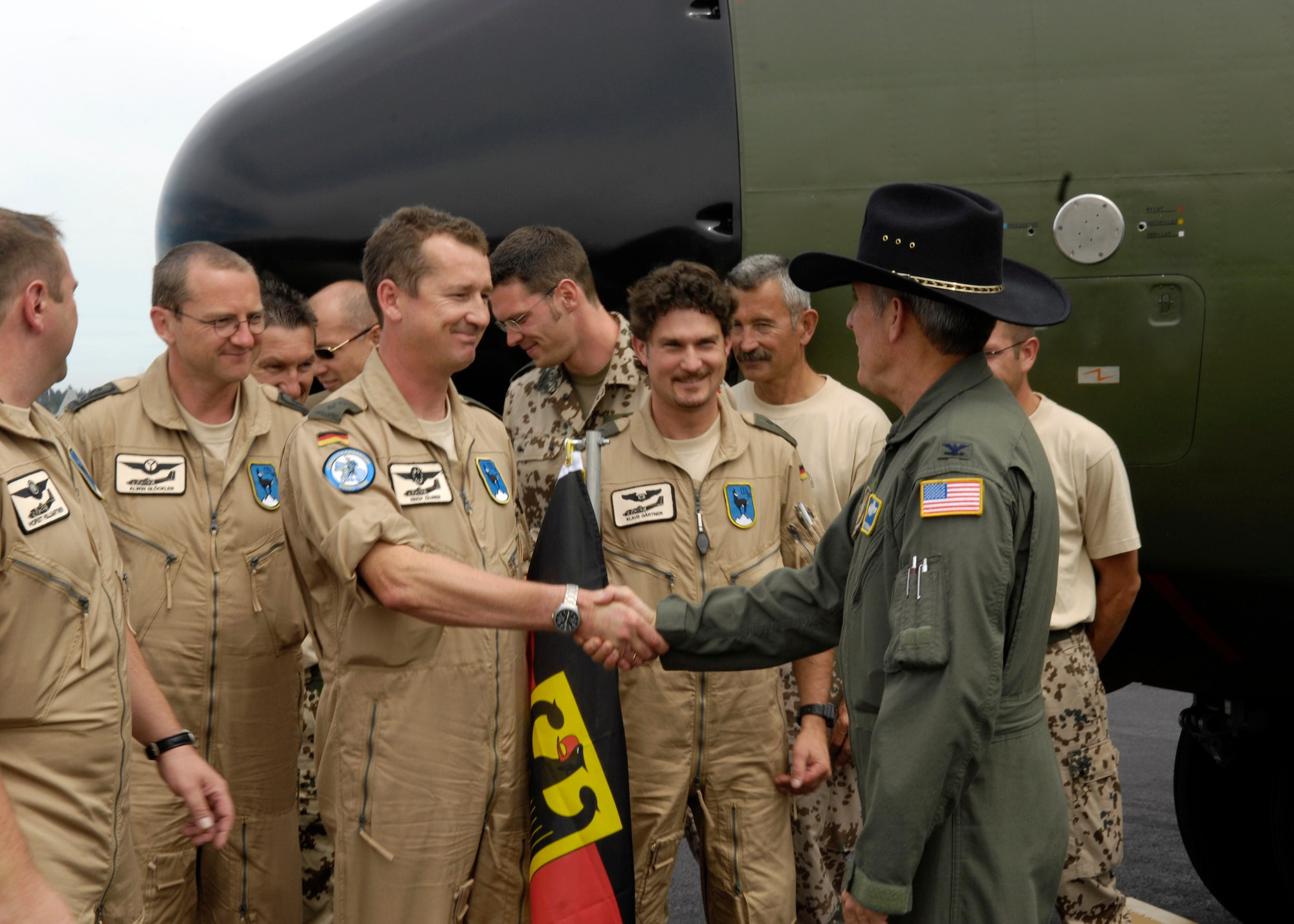 Col. Bill Bradley greets the German Air Force team July 16 at McChord Air Force Base, Wash. Rodeo 2007, hosted by Air Mobility Command, is a readiness competition for U.S. and international mobility forces.  It focuses on improving war fighting capabilities and support of the Global War on Terrorism.  Colonel Bradley is a Rodeo 2007 official. (U.S. Air Force photo/Senior Airman Jacqueline Kabluyen)
