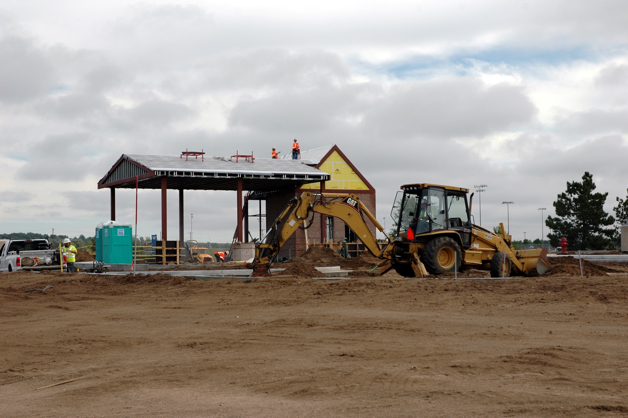 Work continues at the West Gate. Starting July 30, the West Gate will be closed for construction until early November. Drivers will need to enter through either the North or East gates; the North gate will be open 24 hours during the construction. (U.S. Air Force photo by Steve Brady)