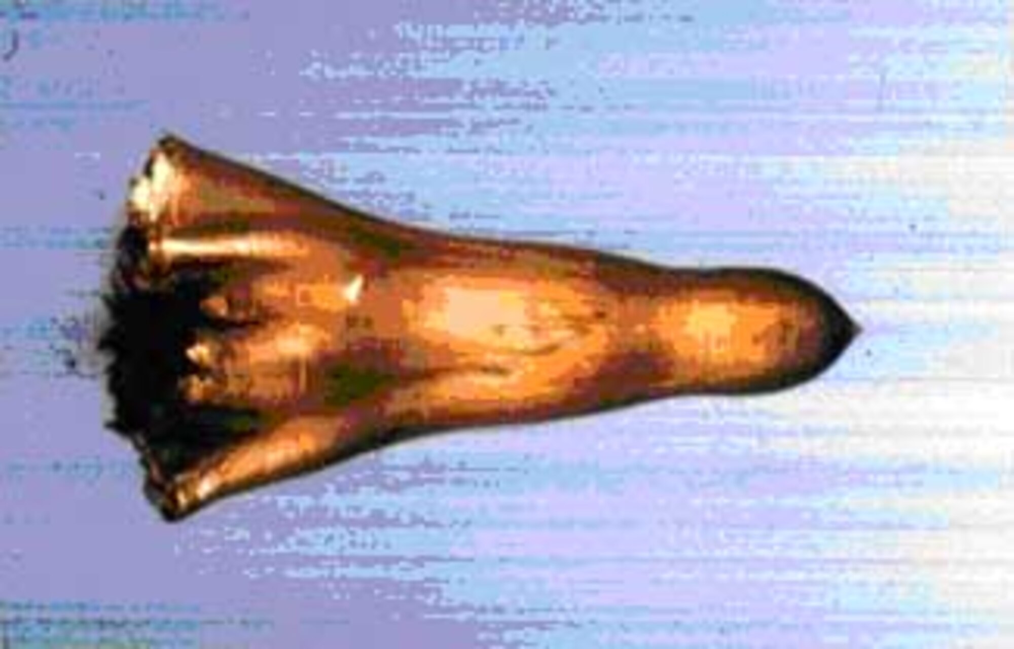The graphic above represents an actual explosively formed penetrator (EFP) in flight at sea level conditions. The body shape starts as a flat plate and forms during flight. Dr. Kirk Vanden, technical advisor at the computational mechanics branch of the munitions directorate of the Air Force Research Laboratory, and his team are currently performing calculations to study aerodynamic stability of complex shapes undergoing real-time dynamic deformation. The Air Force Office of Scientific Research provides funding for this research. (Graphic provided by David Lambert, AFRL/MNMW).