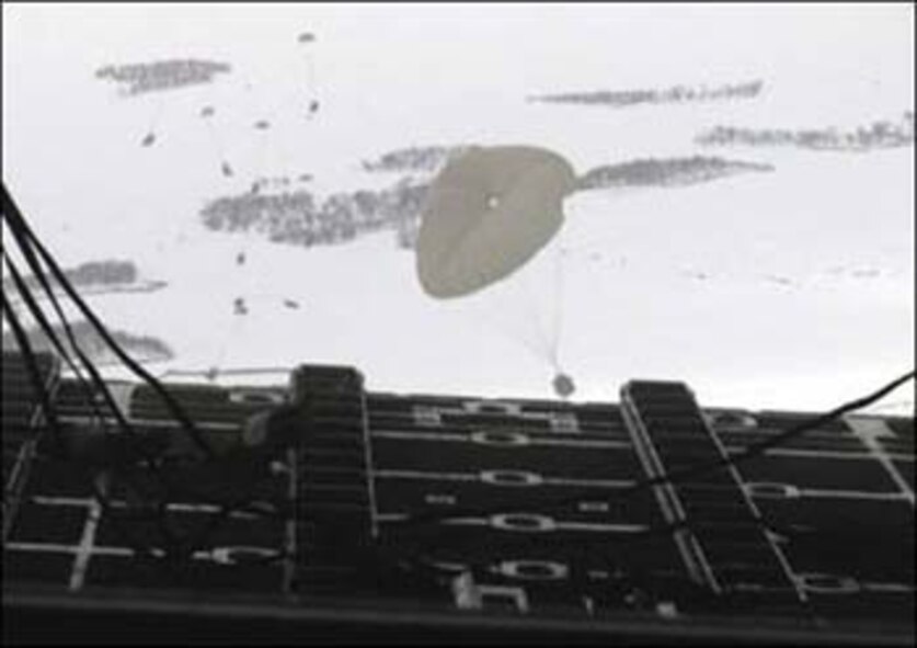 Humanitarian supplies airdropped from the back of a C-130 Hercules (U.S. Air Force photo by Tech. Sgt. Scott Sturkol)