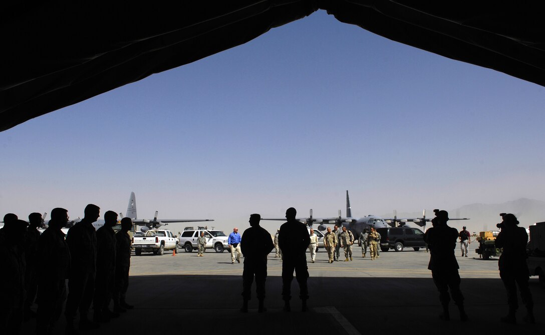 Deputy Secretary of Defense Gordon R. England arrives at a hangar to meet with airmen from the 455th Air Expeditionary Wing deployed to Bagram, Afghanistan, July 20, 2007.  England traveled to Afghanistan to meet with commanders, soldiers and airmen as well as leaders and troops from coalition partners.  
