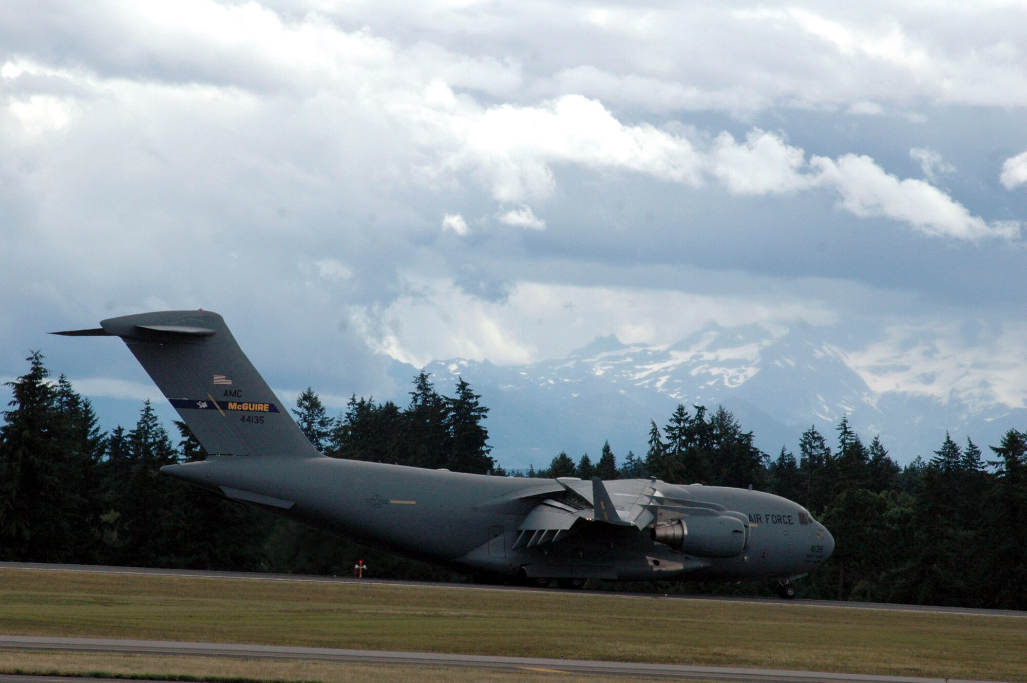A C-17 Globemaster III from McGuire Air Force Base, N.J., comes in for a landing at McChord AFB, Wash., July 21 during operations for Air Mobility Rodeo 2007.Rodeo, sponsored by Air Mobility Command, is a readiness competition for U.S. and international mobility air forces. This competition focuses on improving world-wide mobility forces' professional core abilities. More than 40 teams and 2,500 people from the Air Force, and Air Force Reserve, as well as allied nations, are expected to participate. (U.S. Air Force Photo/Tech. Sgt. Scott T. Sturkol)