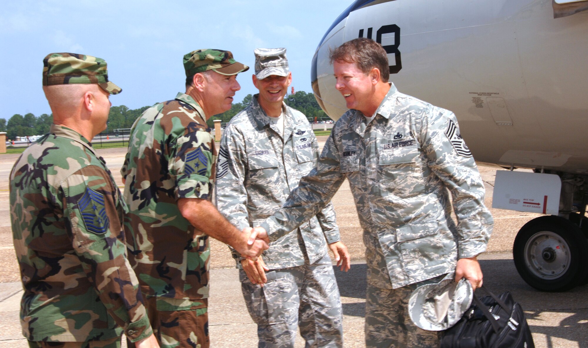 Chief Master Sgt. of the Air Force Rodney J. McKinley is greeted by Air Education and Training Command and Maxwell Air Force Base, Ala., command chief master sergeants July 21 at Maxwell. Chief McKinley and other senior enlisted leaders arrived for the start of the 2007 Senior Enlisted Leader Summit held at nearby Gunter Annex, Ala. "We're eager to begin the summit," Chief McKinley said.  "The Air Force is currently capitalizing on many opportunities and faces several challenges the senior enlisted leaders gathering here are uniquely qualified to address.  I'm looking forward to the information, dialogue and ideas we'll be sharing."  As a cost-saving measure, the Office of the CMSAF arranged for military air, a Navy C-9, to transport senior enlisted leaders from the National Capitol Region to the summit.  The summit kicks off July 22 with a day of physical and athletic conditioning and runs until July 27. (U.S. Air Force photo/Melanie Rodgers)