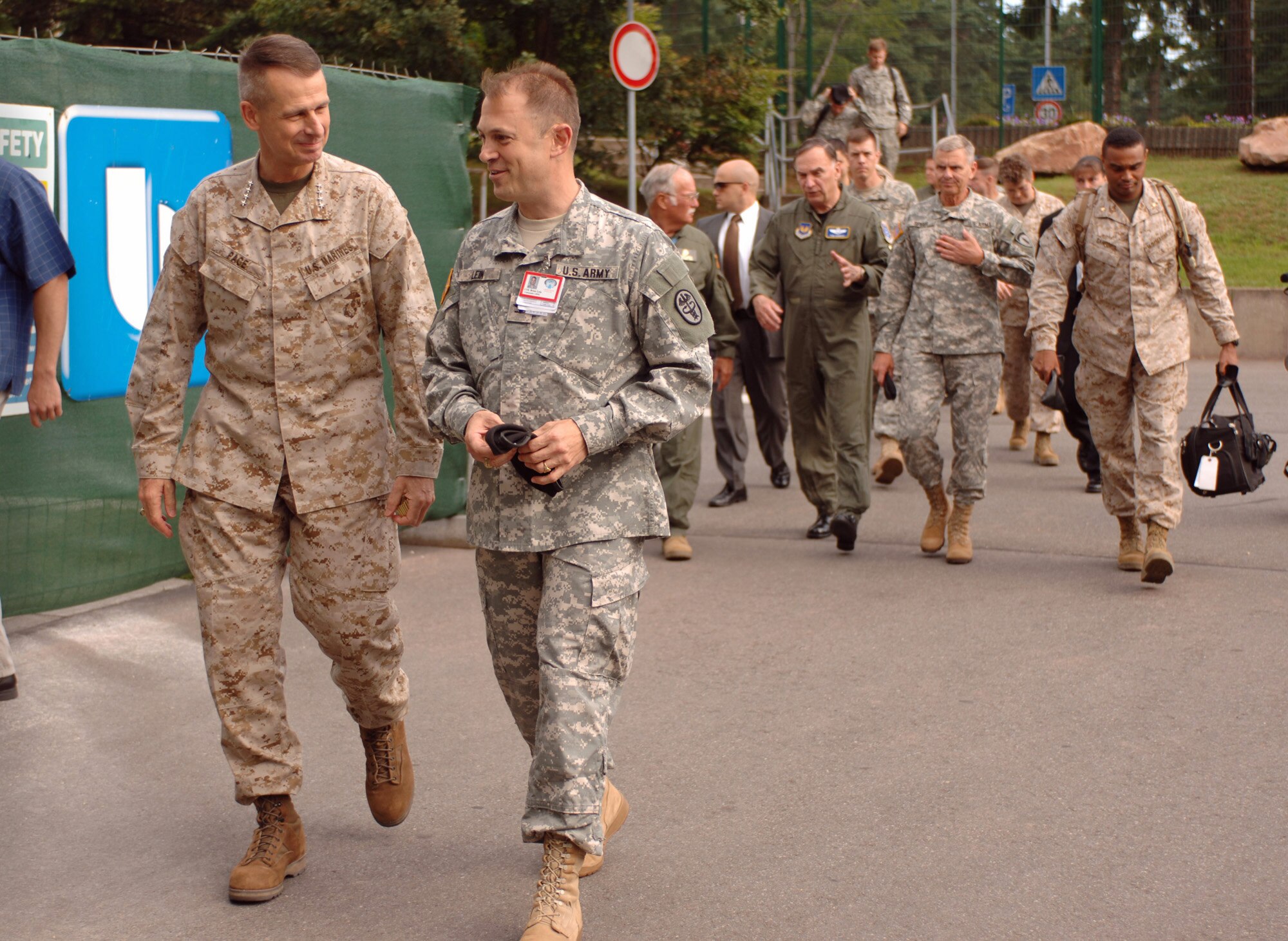 Chairman of the Joint Chiefs of Staff Gen. Peter Pace speaks with Landstuhl Regional Medical Center commander, Col. Brian C. Lein, during a short-notice visit to the largest American hospital outside the United States, July 21. The general presented Purple Heart and spoke with several patients in the intensive care unit. Among those taking part in the visit were Gen. William T. Hobbins, U.S. Air Forces in Europe commander; Lt. Gen. Gary D. Speer, deputy commanding general and chief of staff, U.S. Army Europe and Seventh Army; and H.C. "Barney" Barnum Jr., Medal of Honor recipient and deputy assistant secretary of the Navy Reserve Affairs. (U.S. Air Force photo/Master Sgt. Scott Wagers)

