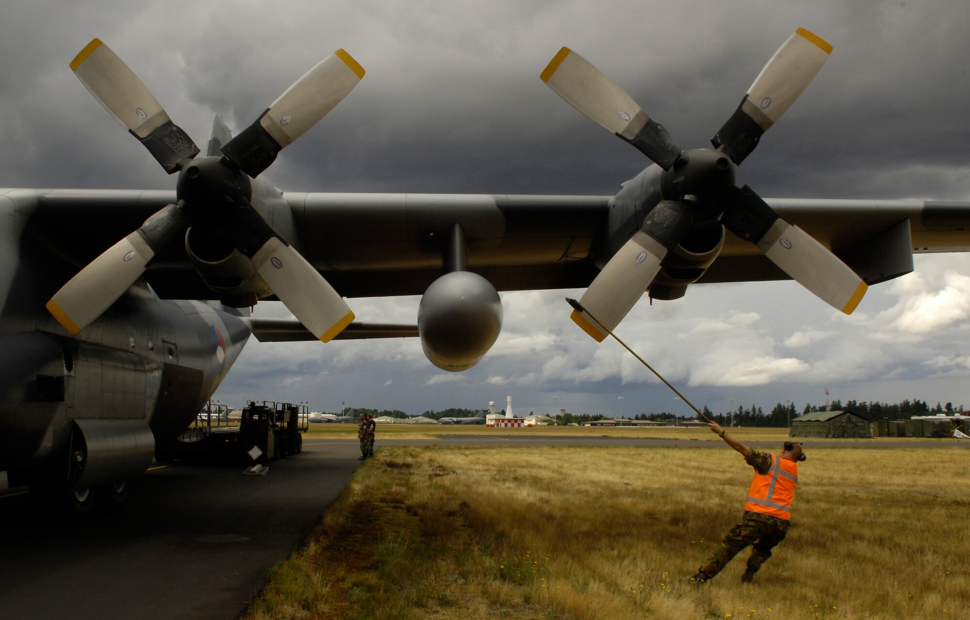 A Royal Netherlands Air Force crew chief positions the props of their C-130 Hercules after a practice sortie prior to the kickoff of Air Mobility Rodeo 2007 July 19. Rodeo 2007, hosted by Air Mobility Command, is a readiness competition of U.S. and international mobility air forces. It focuses on improving warfighting capabilities and support of the Global War on Terrorism.(U.S. Air Force photo/Tech. Sgt. Jerry Morrison) 