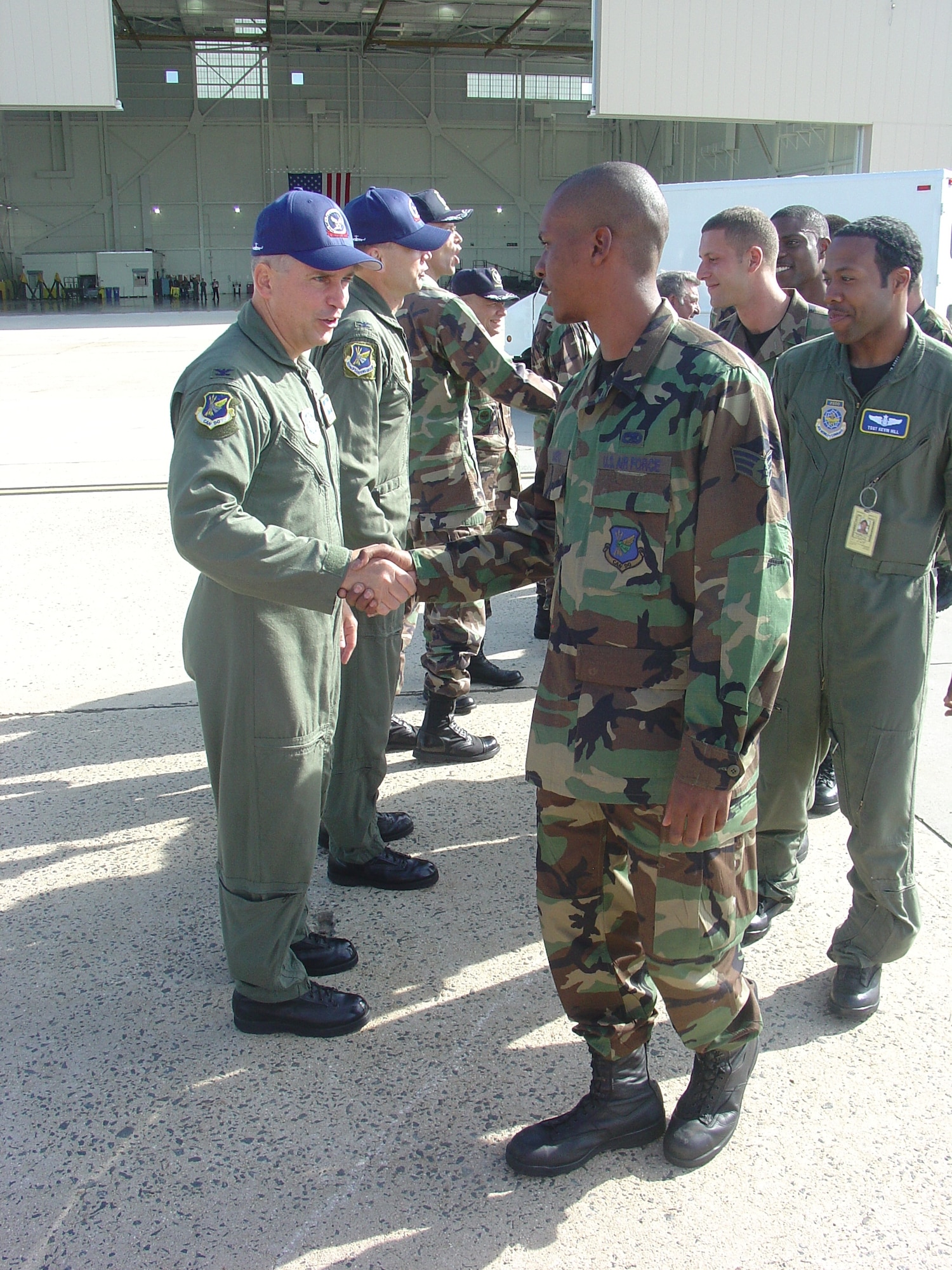 Col. Rick Martin, 305th Air Mobility Wing commander, Col. Harold Rice, 305th Operations Group commander, and several others wish Rodeo team members good luck as they prepare to depart for McChord Air Force Base, Wash. on July 23.  Teams from the 305th AMW, 514th AMW, and the 621st Contingency Response Wing will compete in Air Mobility Command's Rodeo 2007 from July 21 to July 28.