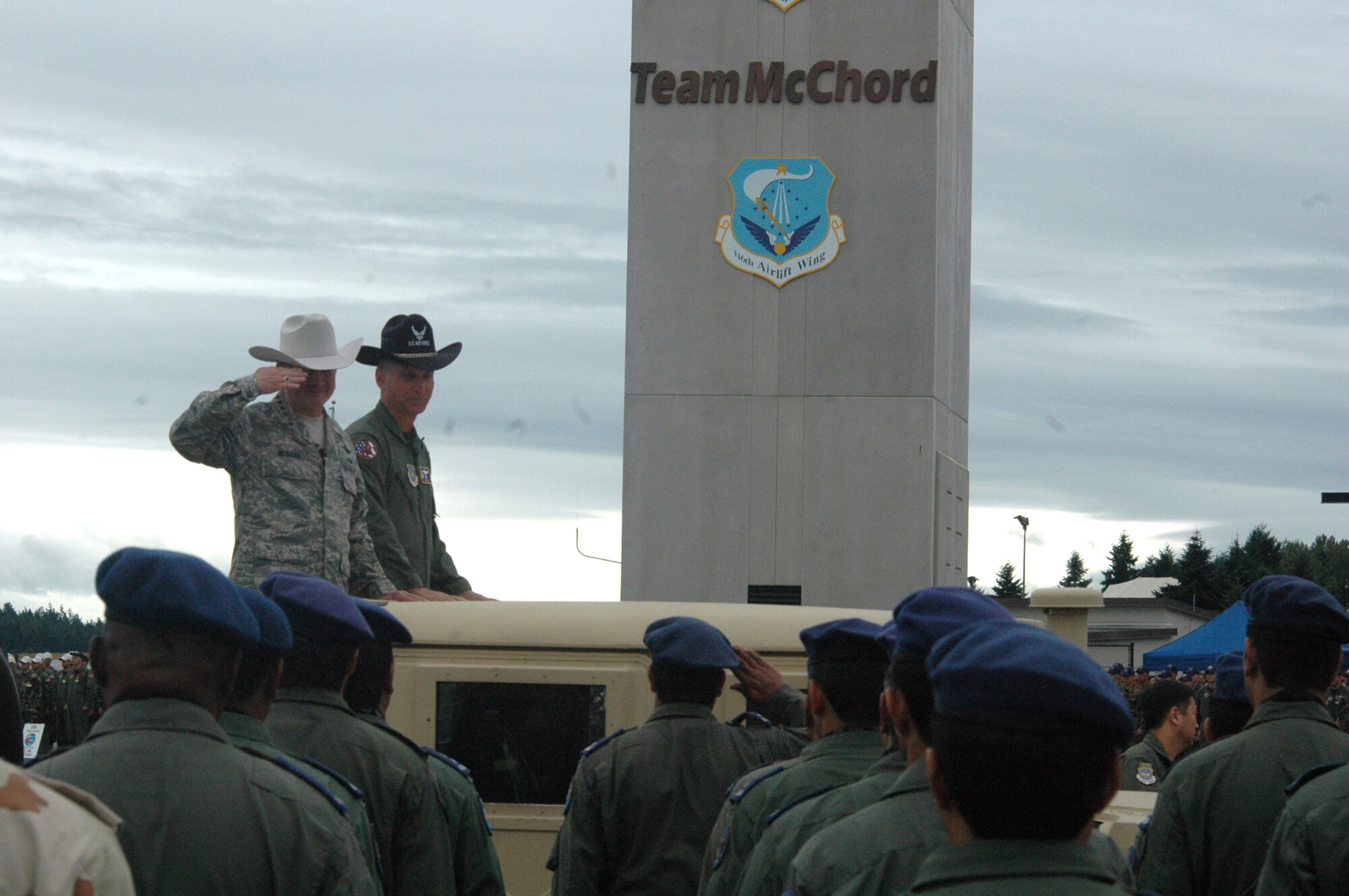 Gen. Duncan McNabb, Air Mobility Command commander, salutes the leader of one of the international teams during the commander review of teams at opening ceremonies for Air Mobility Rodeo July 22 at McChord Air Force Base, Wash.  Rodeo, sponsored by Air Mobility Command, is a readiness competition for U.S. and international mobility air forces.  With General McNabb is Brig. Gen. Kip Self, Rodeo 2007 commander. (U.S. Air Force photo/Tech. Sgt. Scott T. Sturkol)