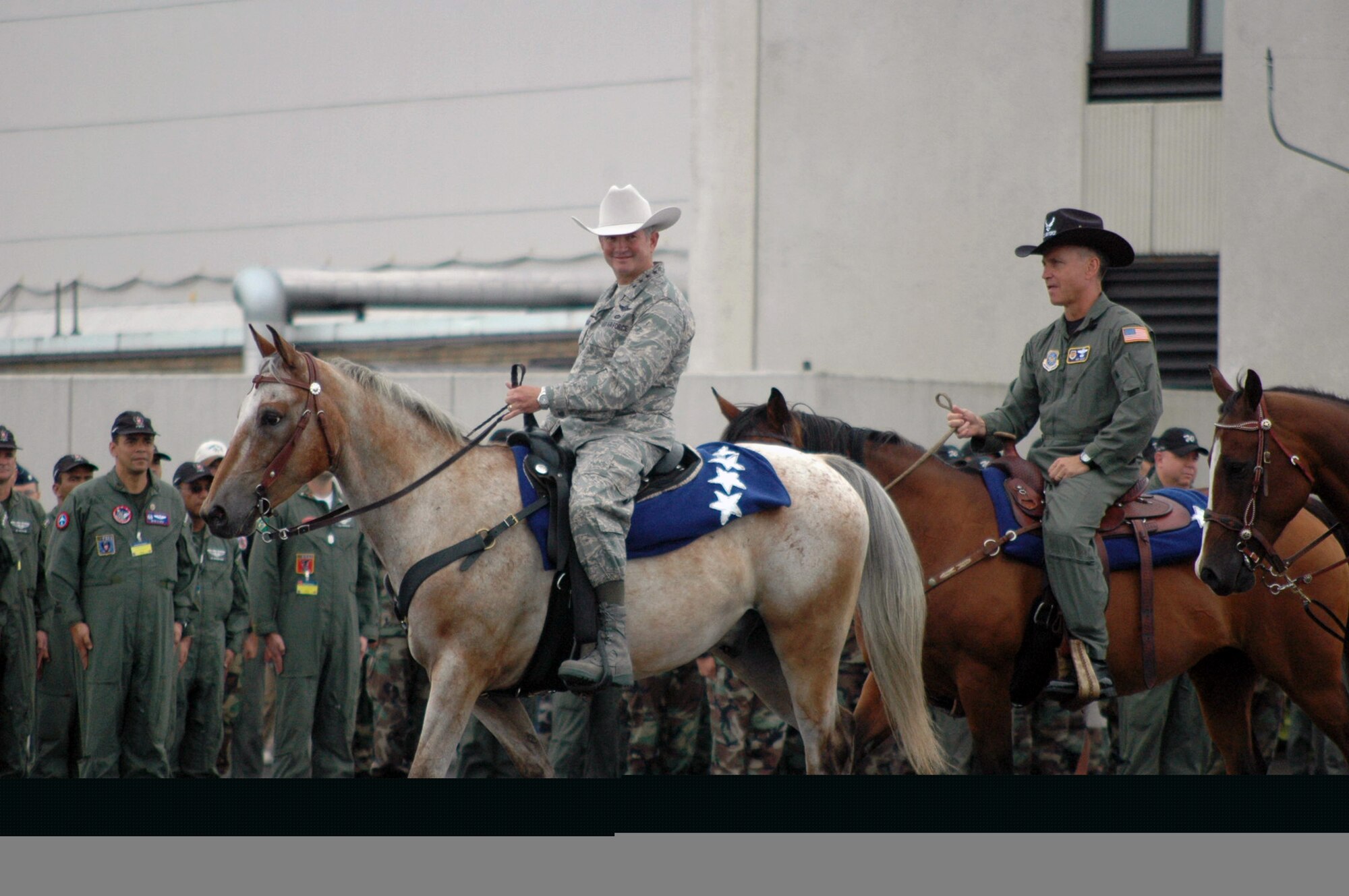 Air Mobility Command Commander, Gen. Duncan McNabb, and Air Mobility Rodeo 2007 Commander, Brig. Gen. Kip Self, make their entrance for the opening ceremony for Rodeo July 22 at McChord Air Force Base, Wash. Rodeo, sponsored by Air Mobility Command, is a readiness competition for U.S. and international mobility air forces.  (U.S. Air Force photo/Tech. Sgt. Scott T. Sturkol)