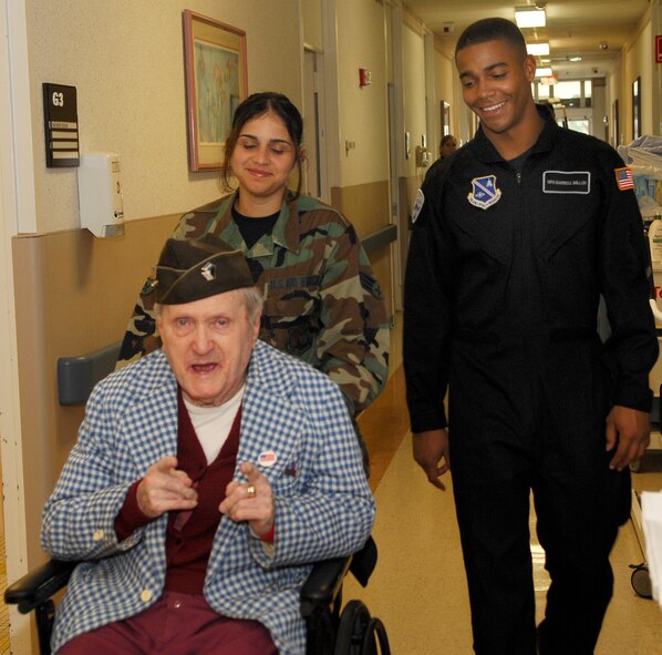 07/10/07-BAY PINES, Fla.--The AF Honor Guard Drill Team spent the day with residents of the Bay Pines VA Hospital near MacDill AFB, Fla.  The Drill Team was joined by members of the MacDill Base Honor Guard.  VA Hospital coordinators said "...the residents will be talking about this through the Winter."  The Airmen spent time learning of the heritage built in the Air Force, as well as the Army, Navy and Marines, by the men & women now residing at the VA hospital.  (U.S. Air Force photo by Airman 1st Class Alexandre Montes)