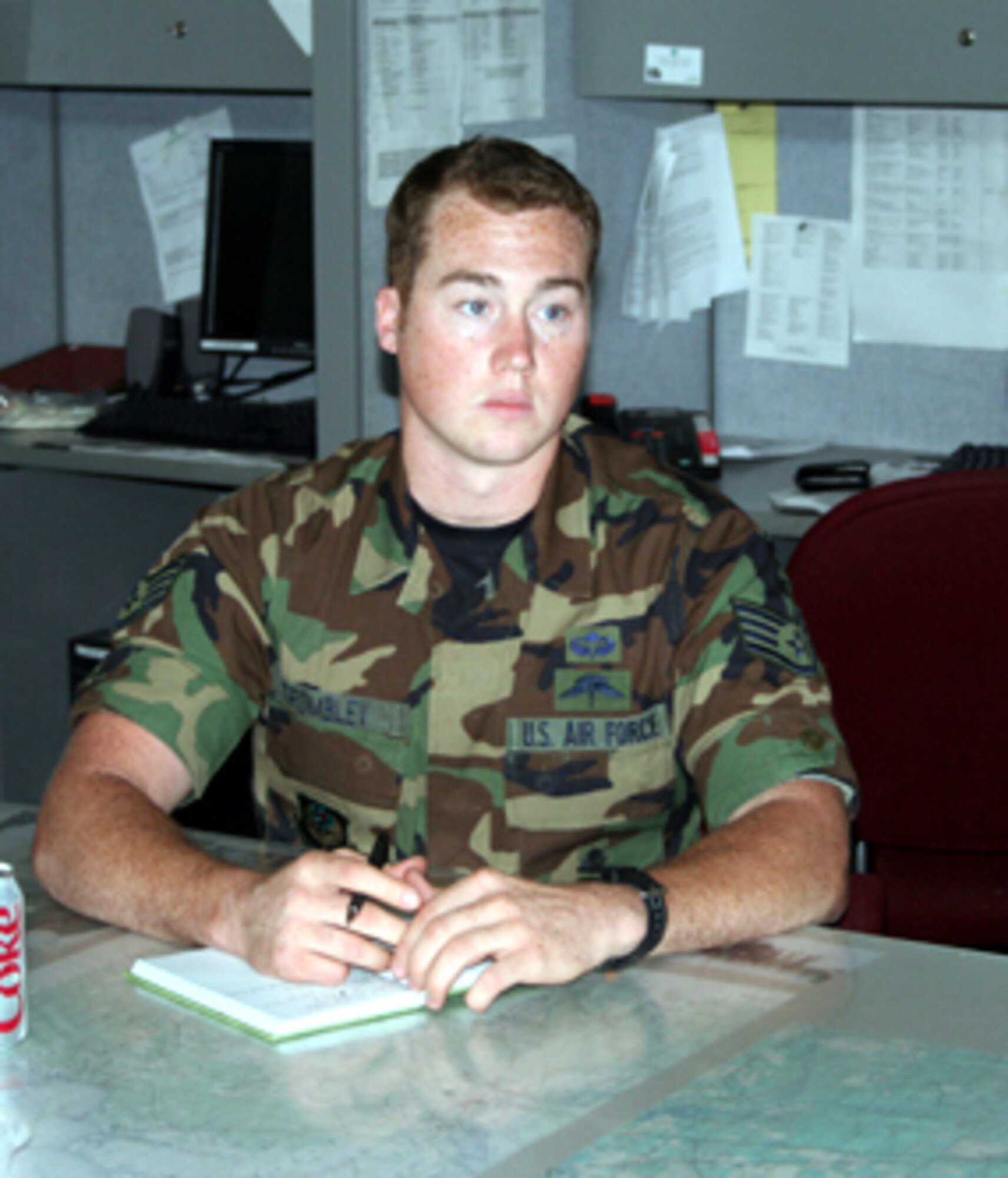 Staff Sgt. Joshua Trombley listens to a briefing during a weekly staff meeting at the 23rd Special Tactics Squadron. Sergeant Trombley, a pararescueman, attempted to save a man's life July 9. Photo by Jamie Haig.